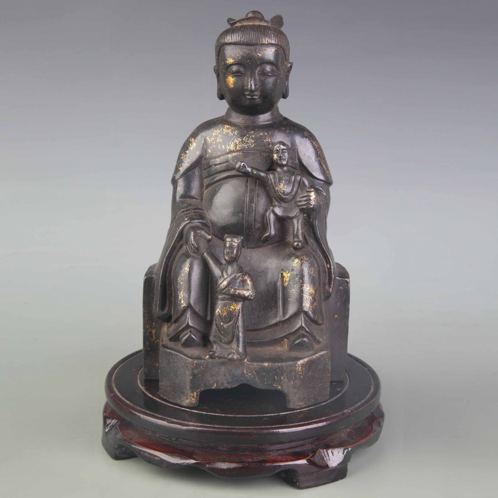 A FIGURE OF BRONZE SONGZI GUANYIN "CHILD-GIVING GUANYIN": 19th Century; High: 8.9 inch; . Wooden base for display only