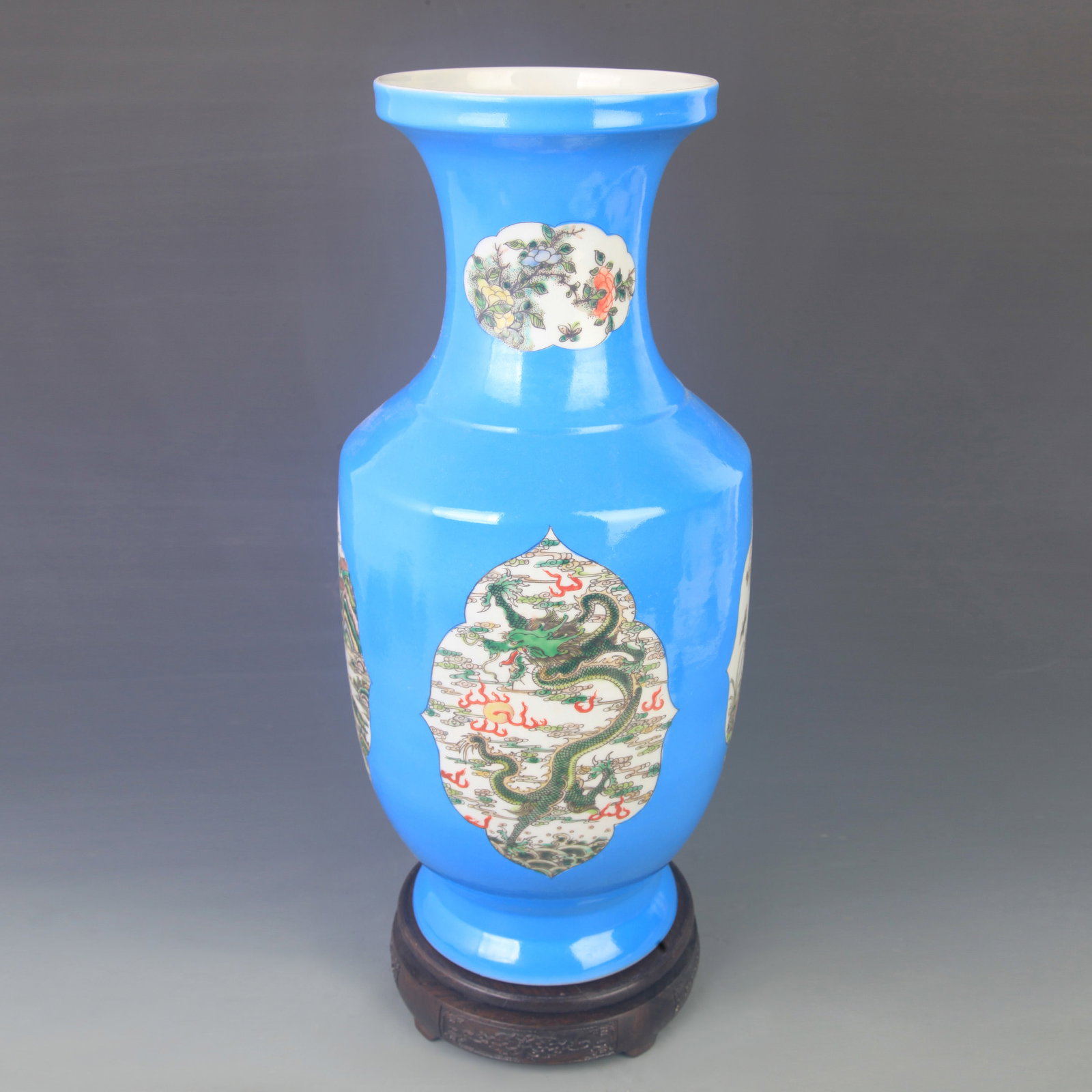 BLUE-GROUND PORCELAIN VASE WITH DRAGON MEDALLIONS: Qing Dynasty Kang Xi Period; High: 16.5 inch; Diameter: 7.50 inch; . Wooden base for display only