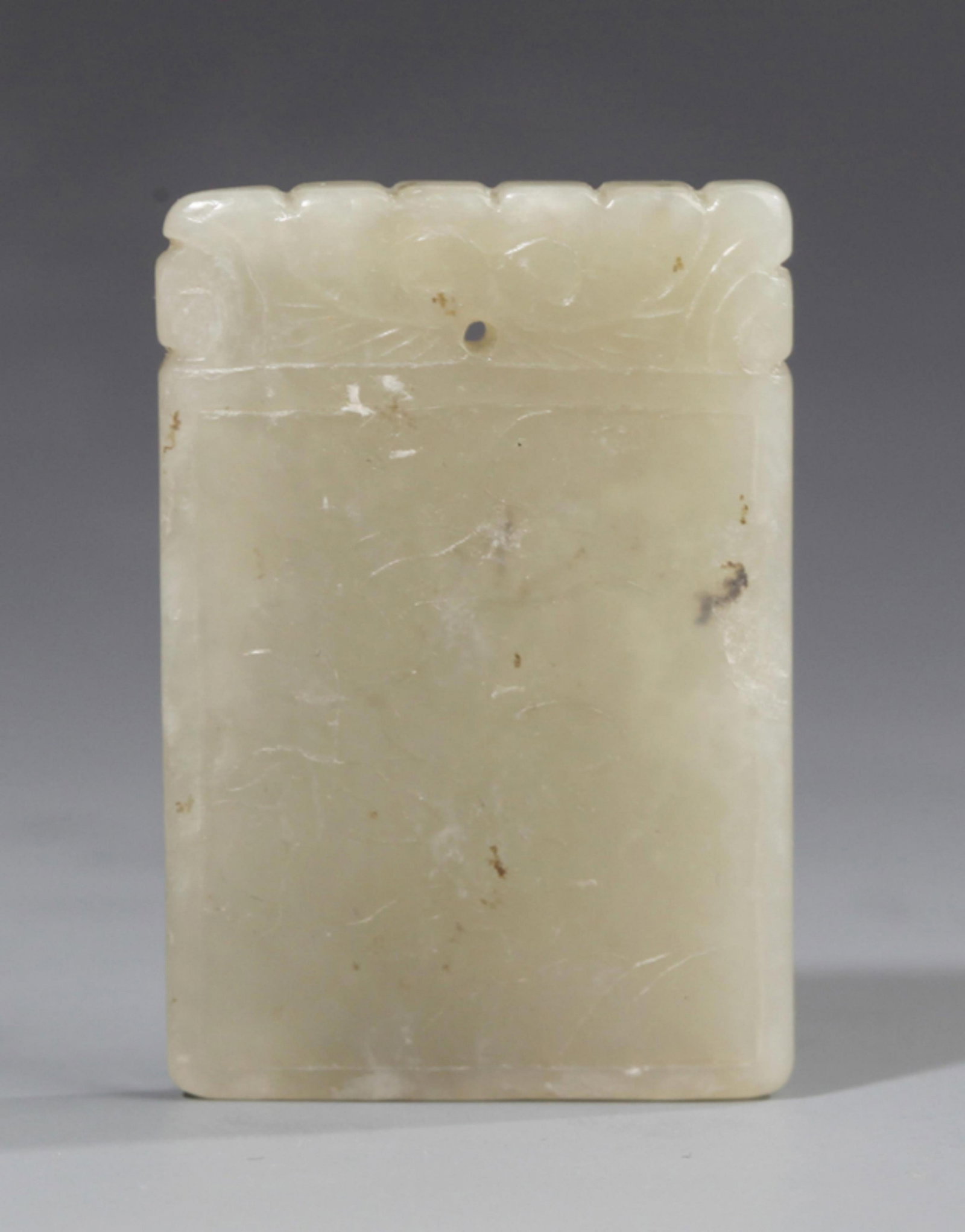 A FINE FLOWER PATTERN PALE CELADON JADE PENDANT: 20th Century; Long: 1.61 inch; Width: 1.14 inch; . Wooden base for display only
