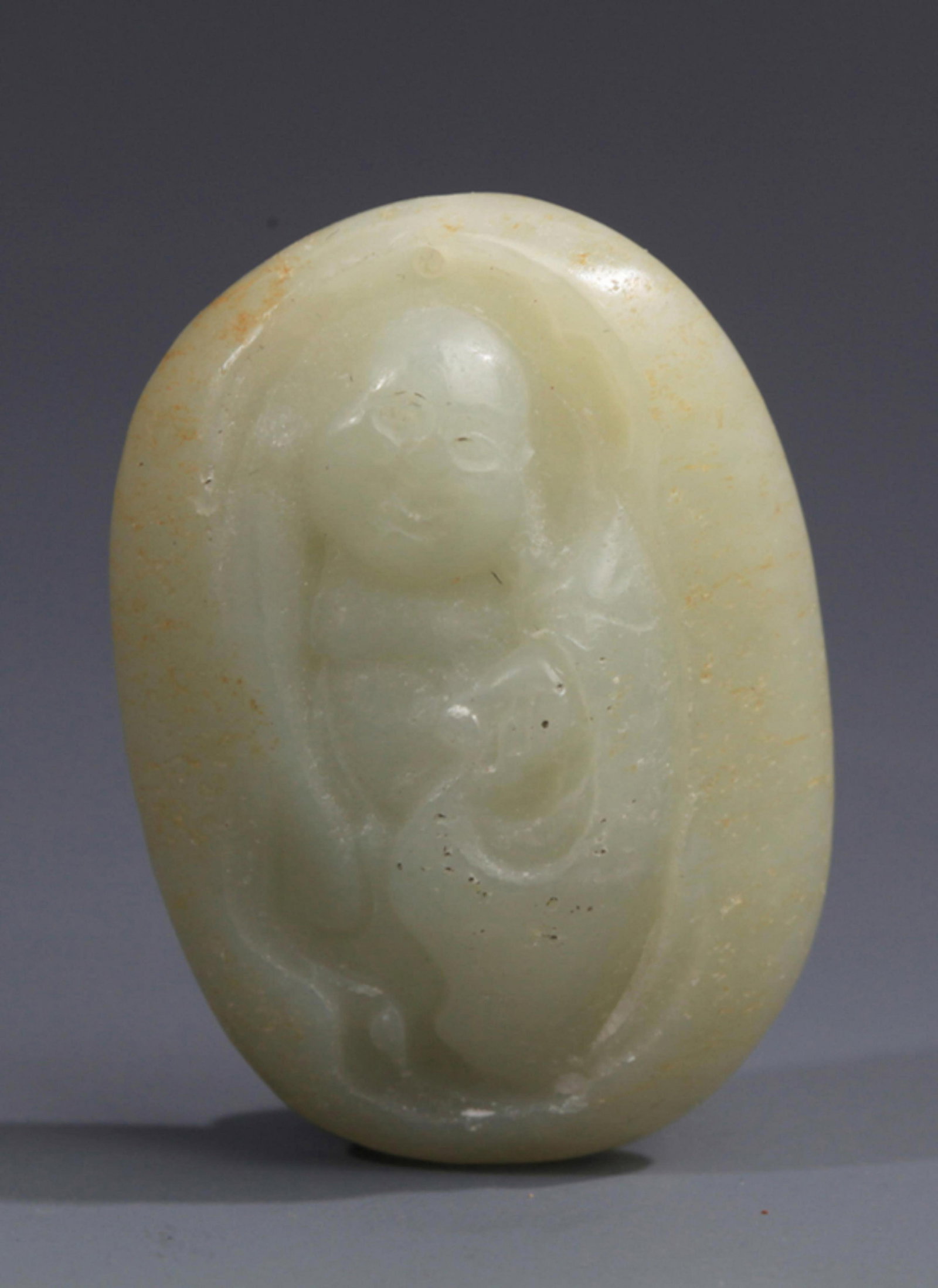 A FINE PALE CELADON JADE PENDANT: Republic Period; Long: 3.5 inch; Width: 2.5 inch. Wooden base for display only