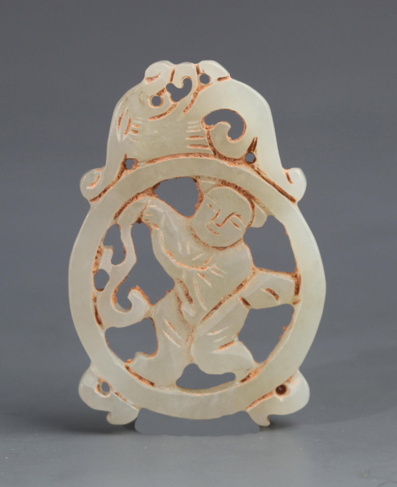A FINE PALE CELADON JADE IN FIGURE OF BOY: Republic Period; High: 1.69 inch; High: 0.43 inch; . Wooden base for display only