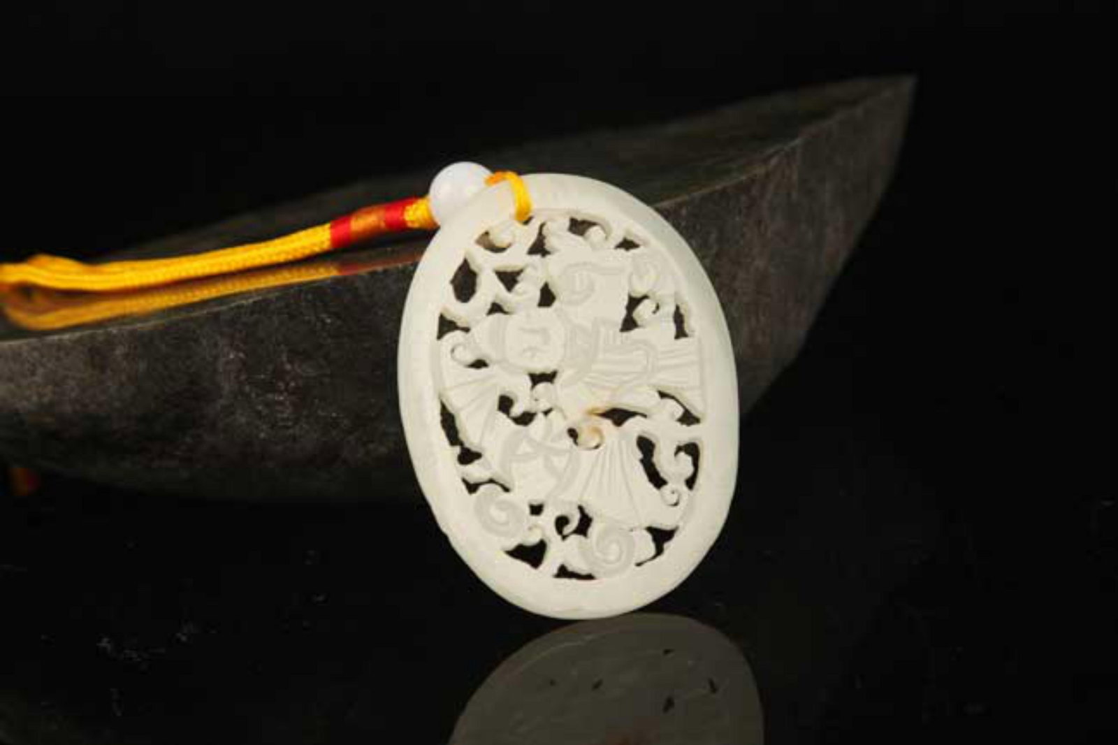 A FINE HE TIAN CHARACTER PATTERN JADE PLAQUE: Contemporary; High: 1.8 inch; Width: 2.4 inch; . Wooden base for display only