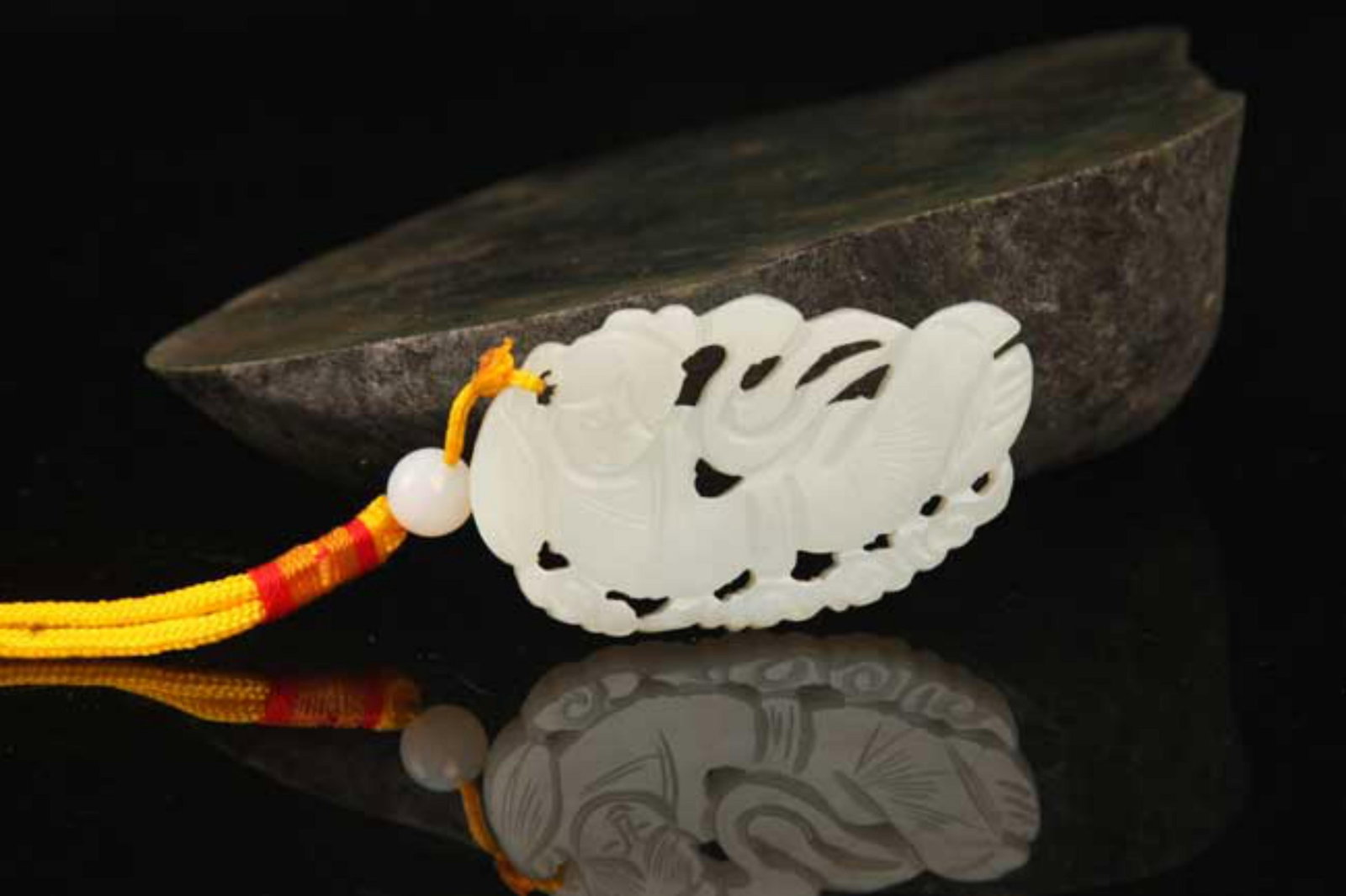 A FINE HETIAN JADE IN FIGURE OF FEMALE: Modern; High: 1.4 inch; Width: 2.6 inch; . Wooden base for display only