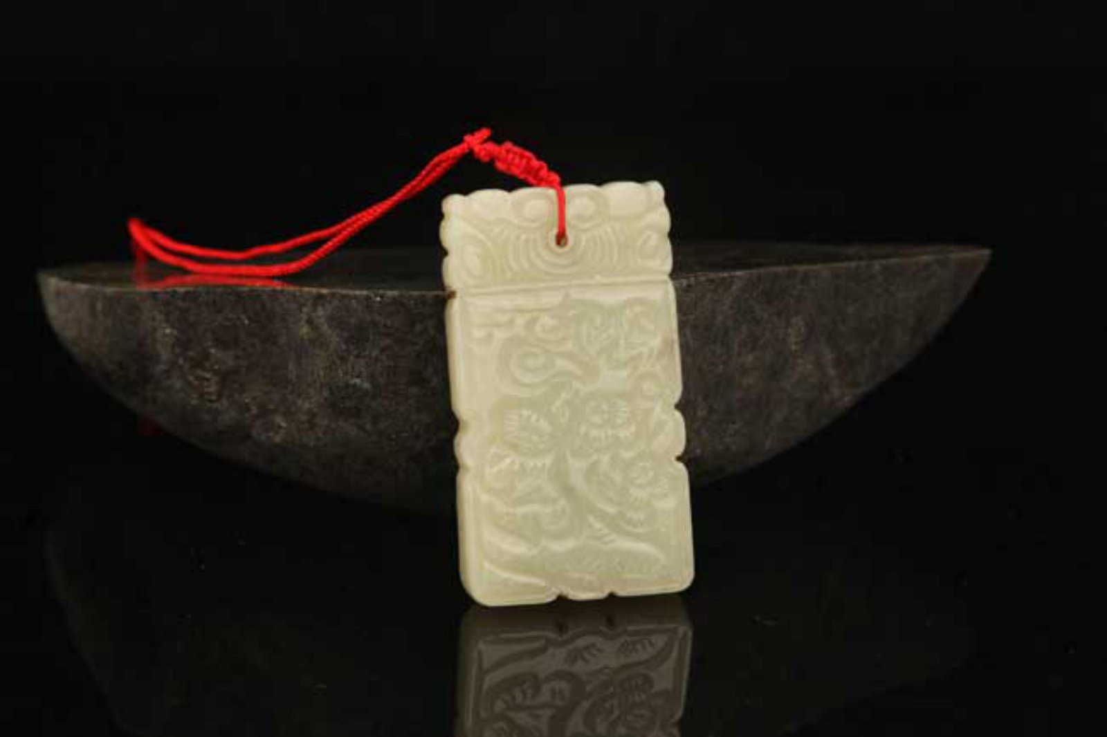 A FINE HETIAN BOY FIGURE JADE PENDANT: Modern; High: 2.5 inch; Diameter: 1.3 inch; . Wooden base for display only