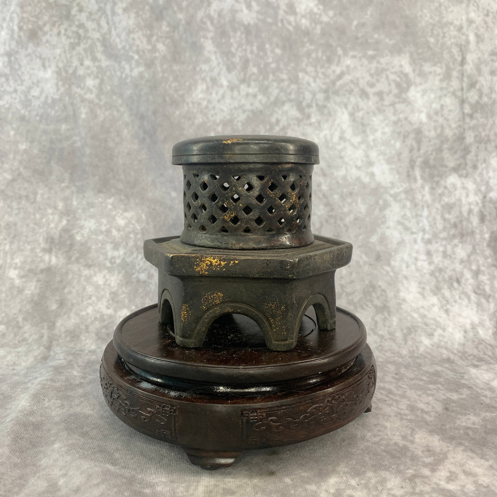 PAGODA-FORM BRONZE INCENSE BURNER: Qing Dynasty; High: 4.5 inch; Diameter: 5.1 inch; . Wooden base for display only