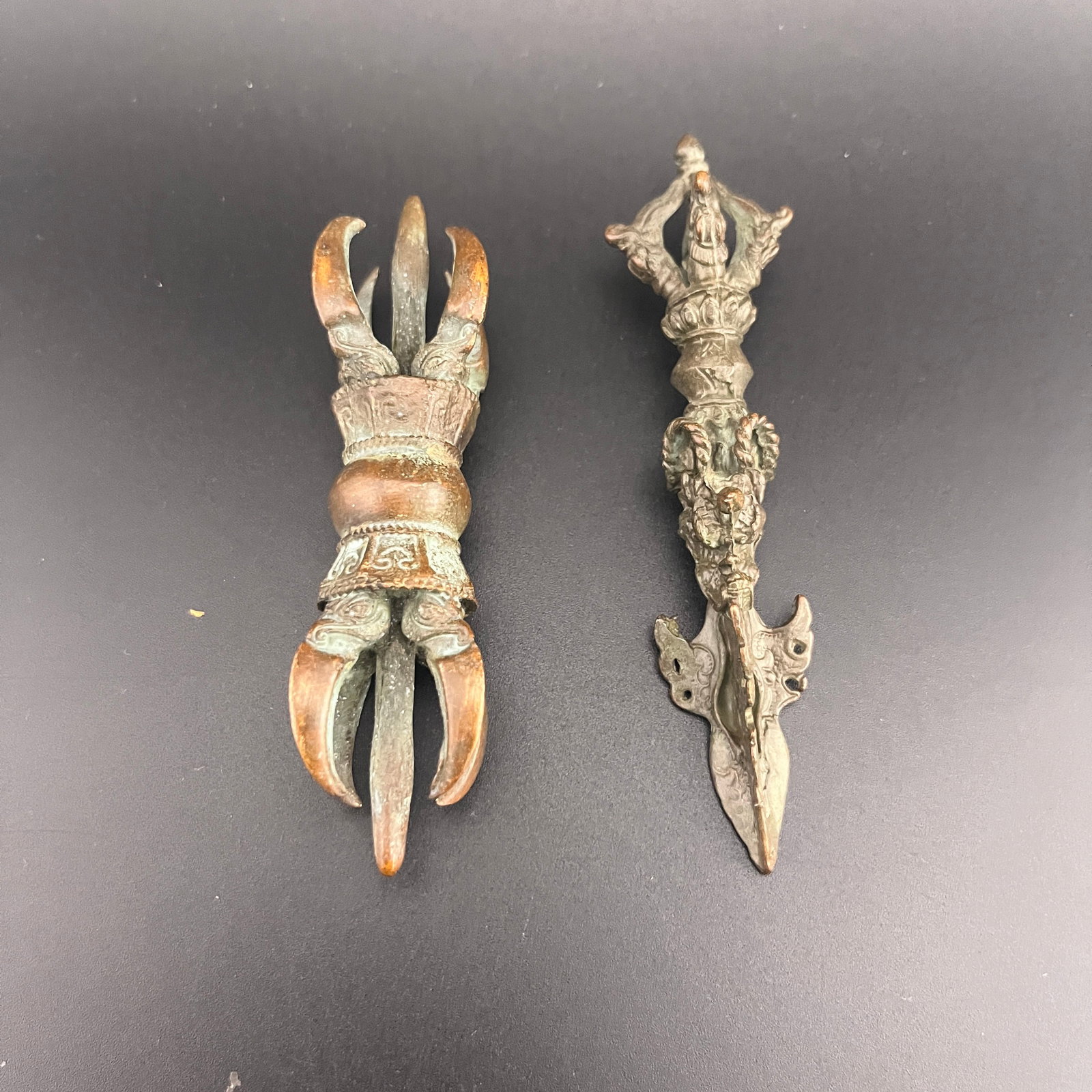 TIBETAN RITUAL BRONZE PHURBA DAGGER & SYMMETRICAL VAJRA SET: Qing Dynasty; Long: 3.9 inch; Diameter: 1.2 inch; Long: 4.3 inch; Diameter: 1.1 inch; . Wooden base for display only