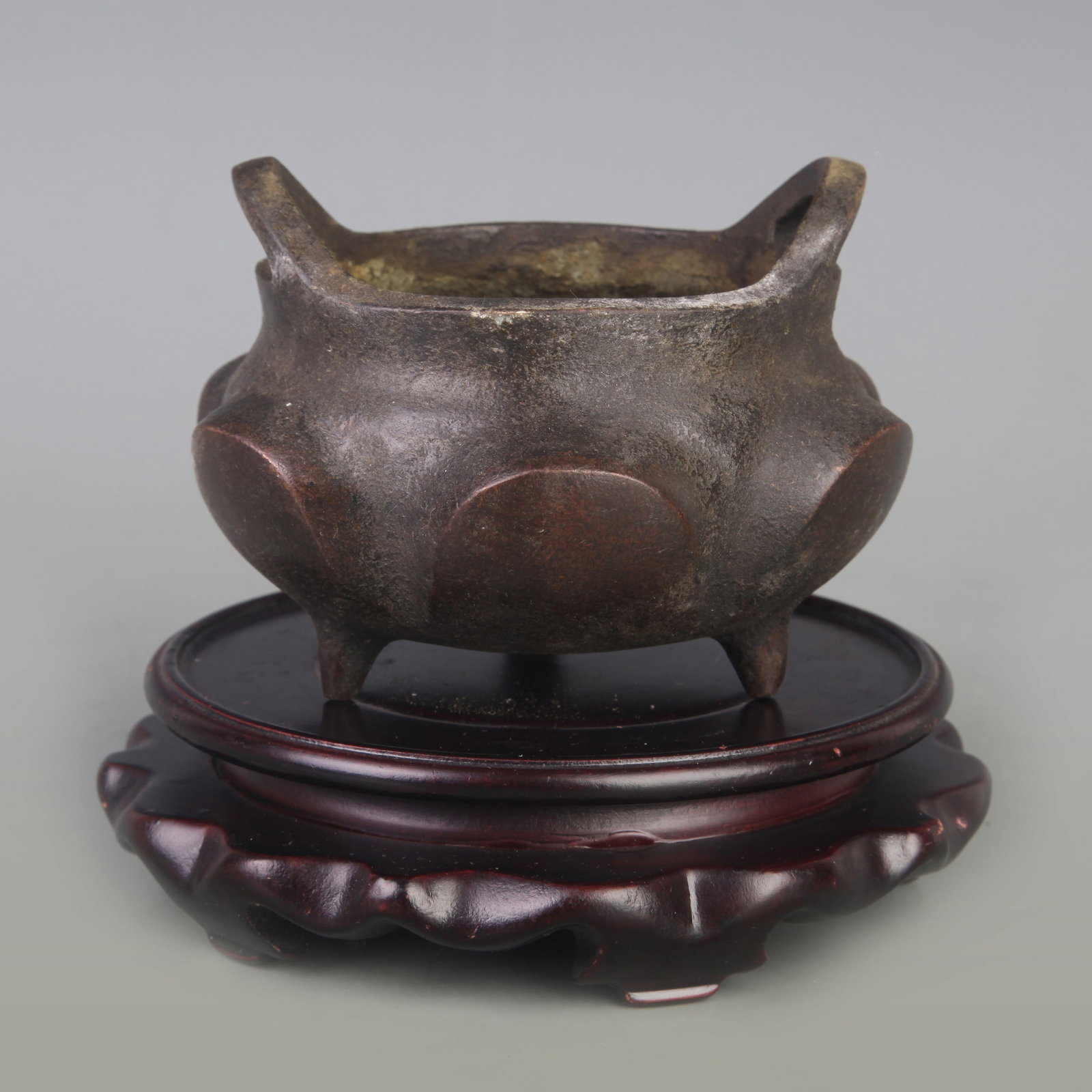 BRIDGE-EARED TRIPOD INCENSE BURNER: Ming Dynasty Style; Diameter: 3.7 inch; High: 3.2 inch. Wooden base for display only