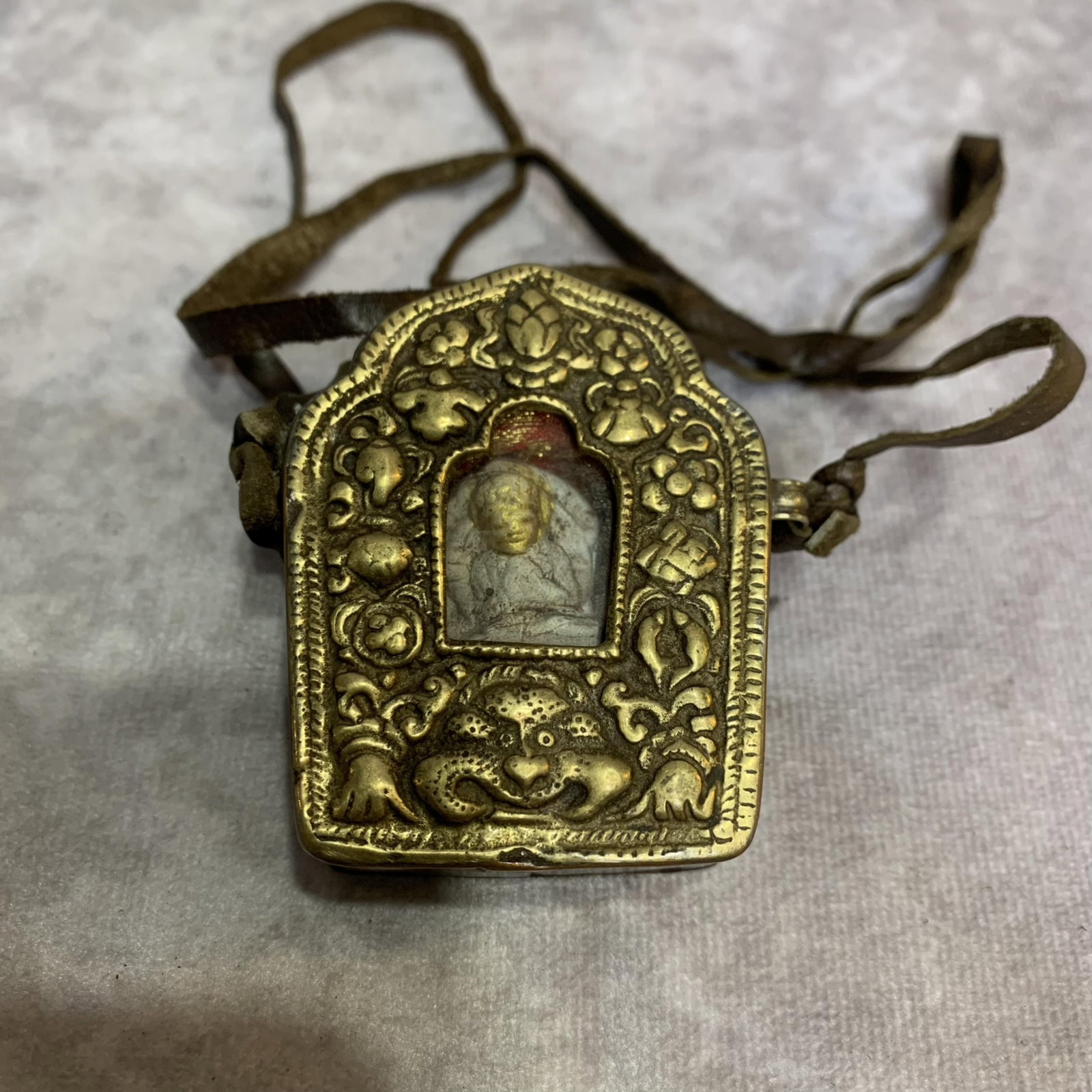 A FINELY MADE TIBETAN BUDDHISM PENDANT: Modern; High: 2.3 inch; Width: 1.8 inch; Diameter: 0.8 inch . Wooden base for display only