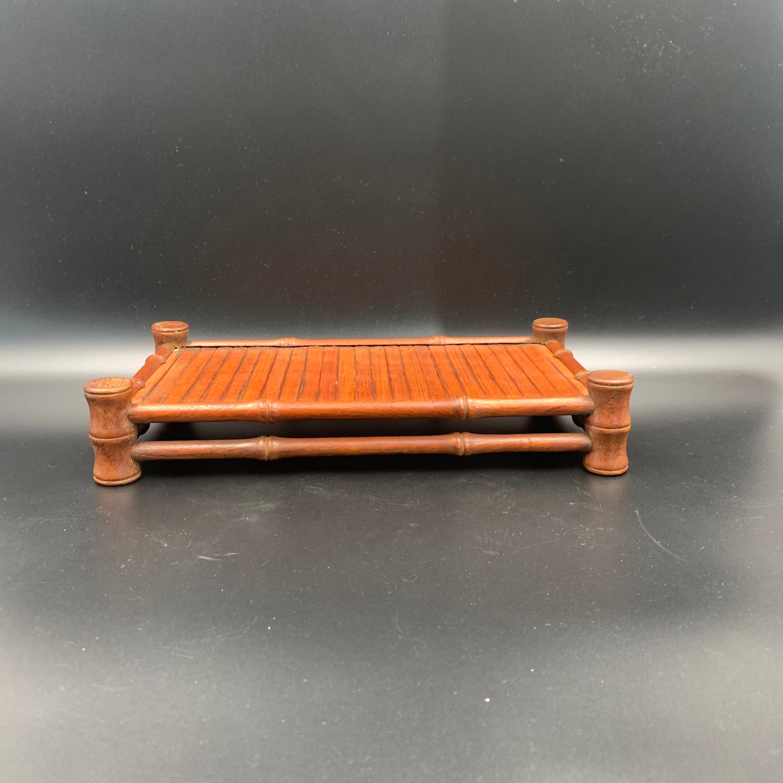 CARVED WOOD BAMBOO-IMITATION DISPLAY STAND: Modern; Long: 13 inch; Width: 7.4 inch; High: 2.4 inch; . Wooden base for display only
