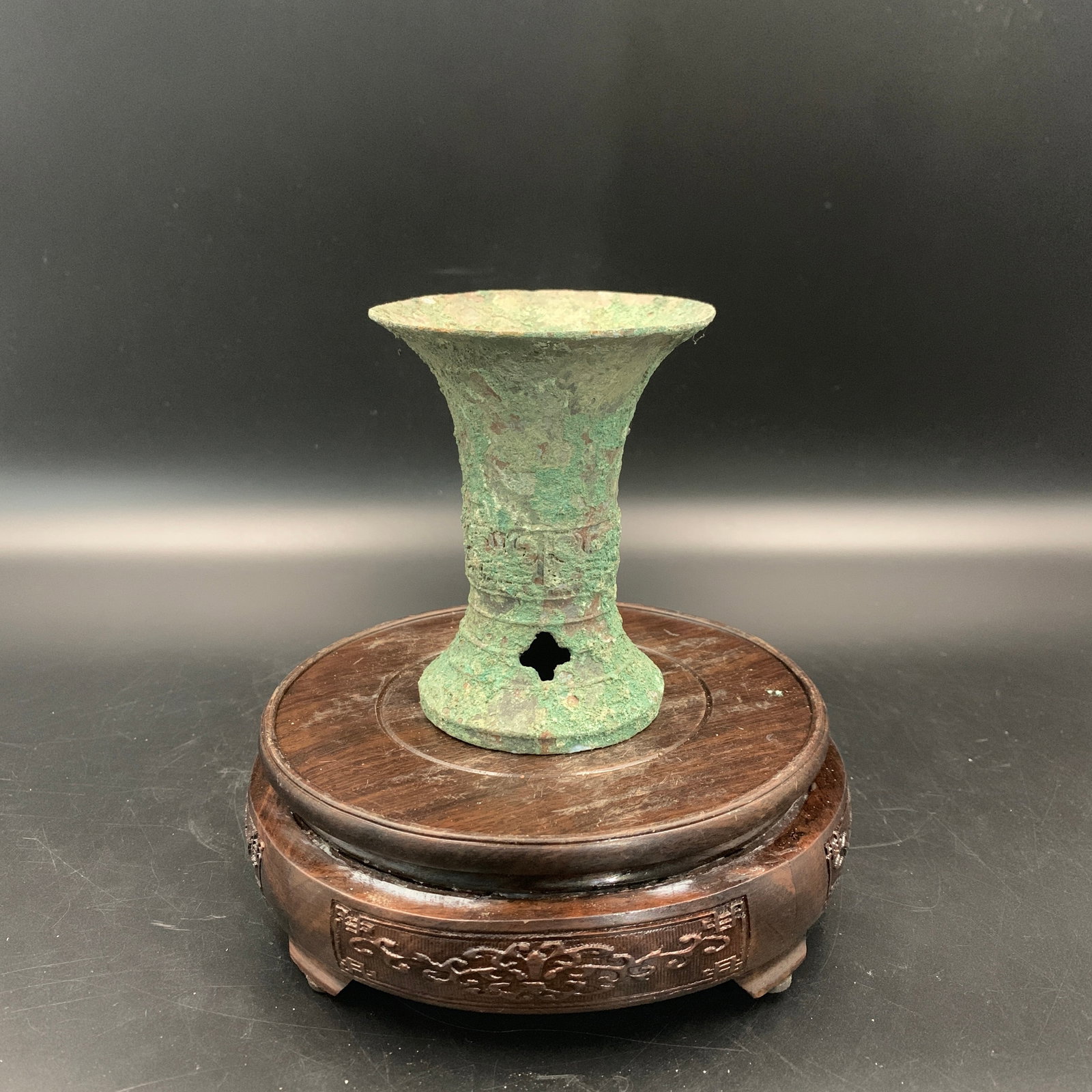 MINIATURE BRONZE GU SHAPED WINE VESSEL: ; High: 4.2 inch; Diameter: 3.4 inch; . Wooden base for display only