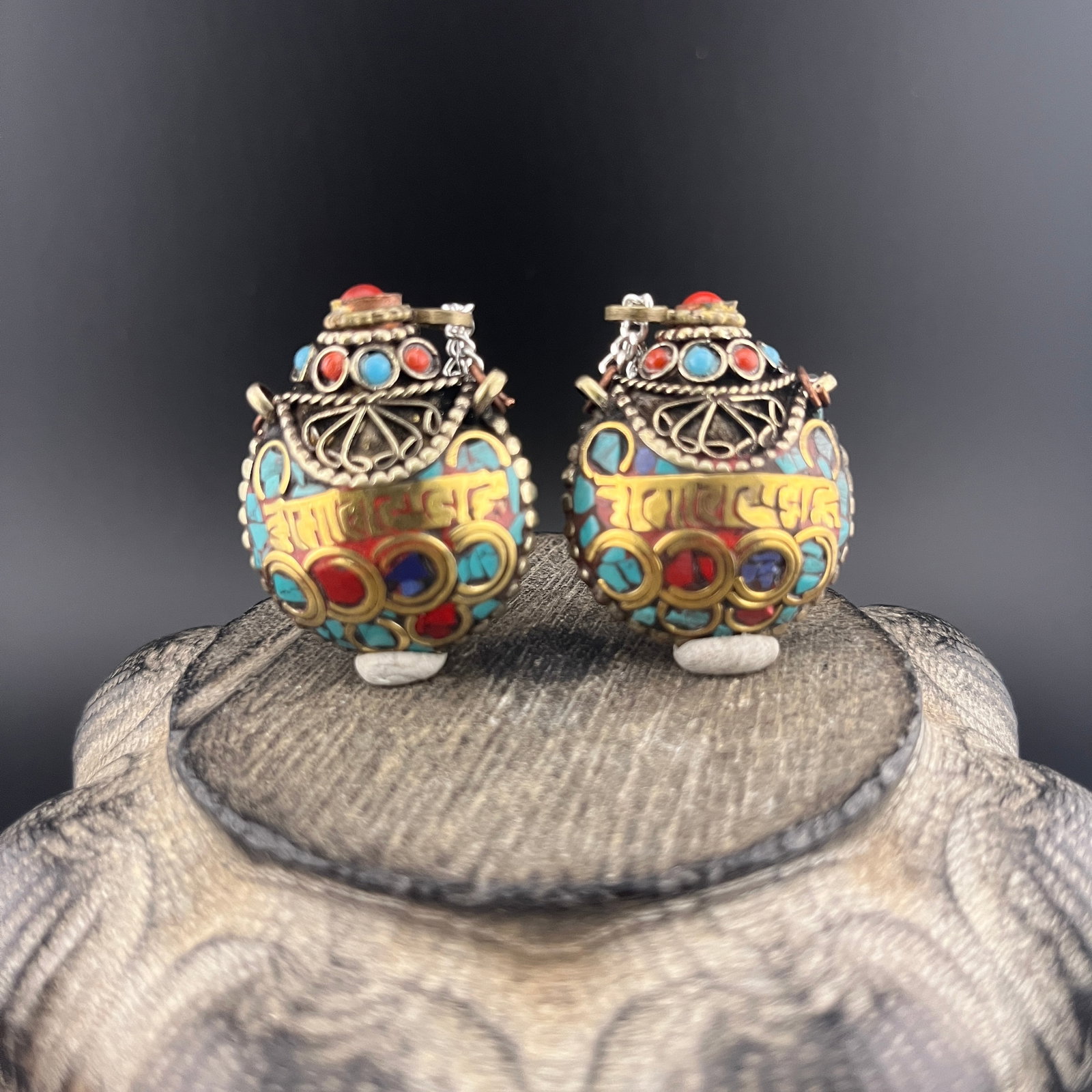 PAIR OF TIBETAN INSET GILT-SCRIPT SNUFF BOTTLE: Modern; Long: 1.3 inch; Width: 1.18 inch; High: 0.68 inch; . Wooden base for display only
