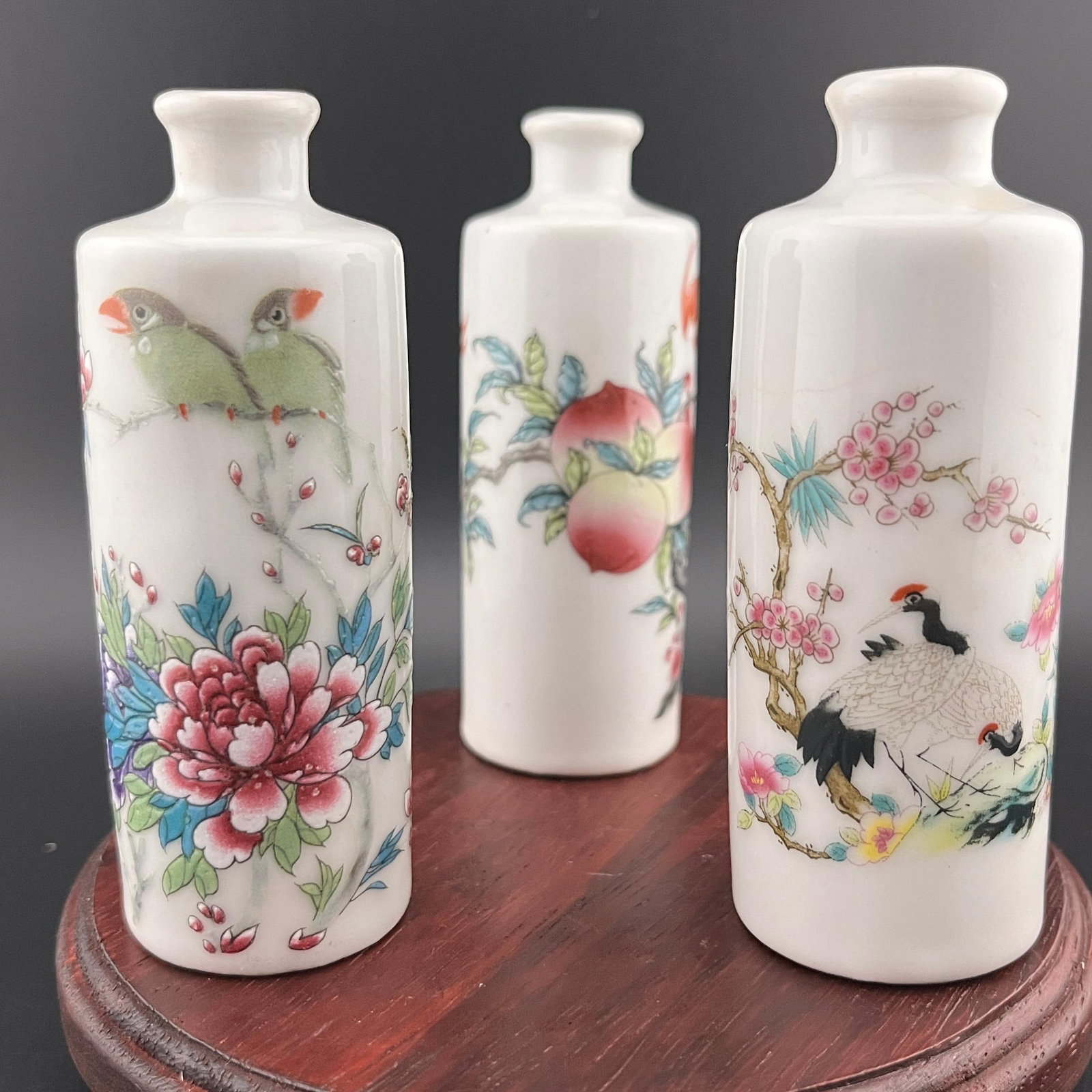 GROUP OF THREE FAMILLE ROSE SNUFF BOTTLES
