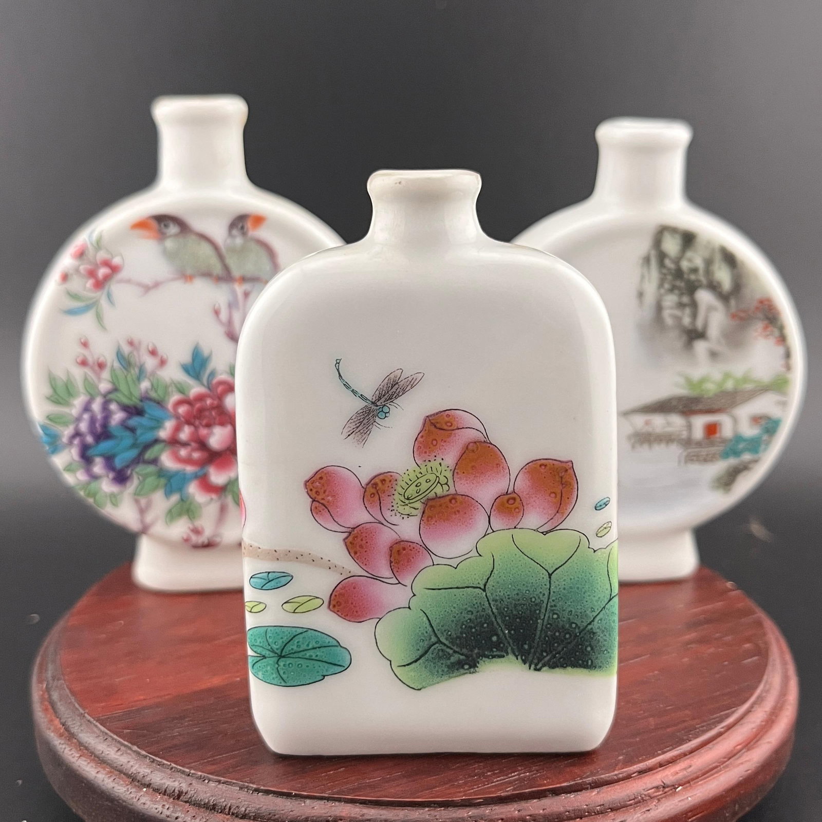 GROUP OF THREE FAMILLE ROSE SNUFF BOTTLES