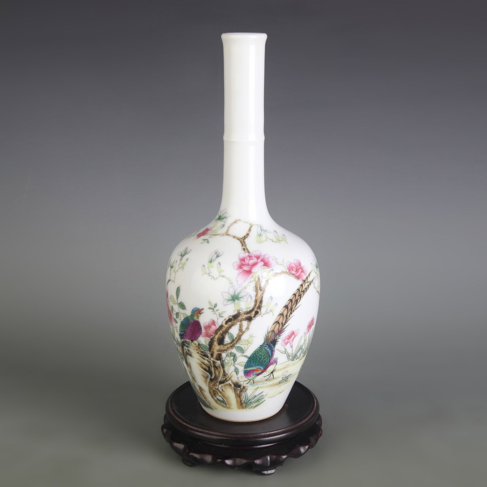 FAMILLE ROSE LONG-NECKED BIRD AND FLOWER PATTERN PORCELAIN VASE: Qing Dynasty Yong Zheng Period; Diameter: 2.6 inch; High: 11.5 inch. Wooden base for display only