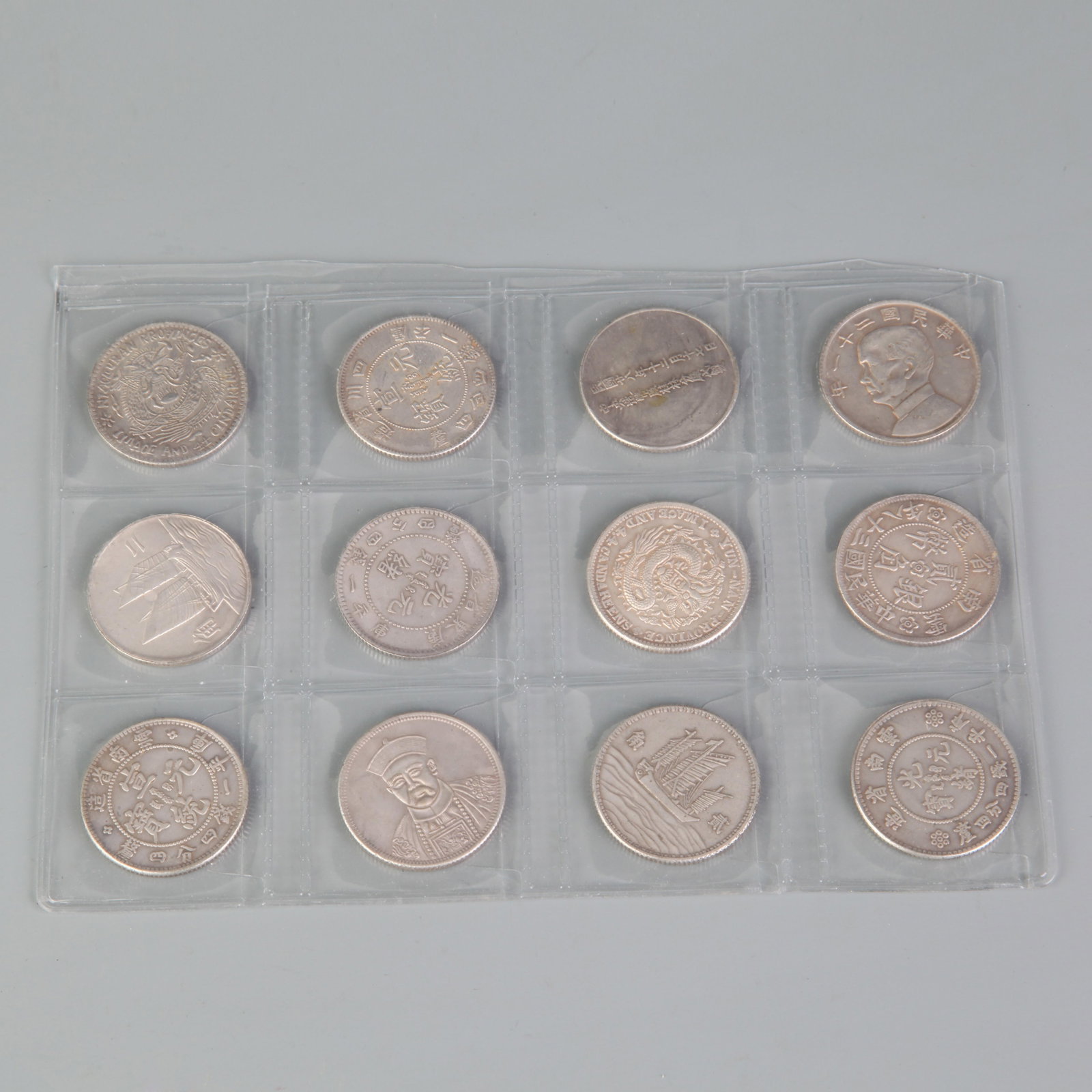 GROUP OF TWELVE SILVER DOLLARS