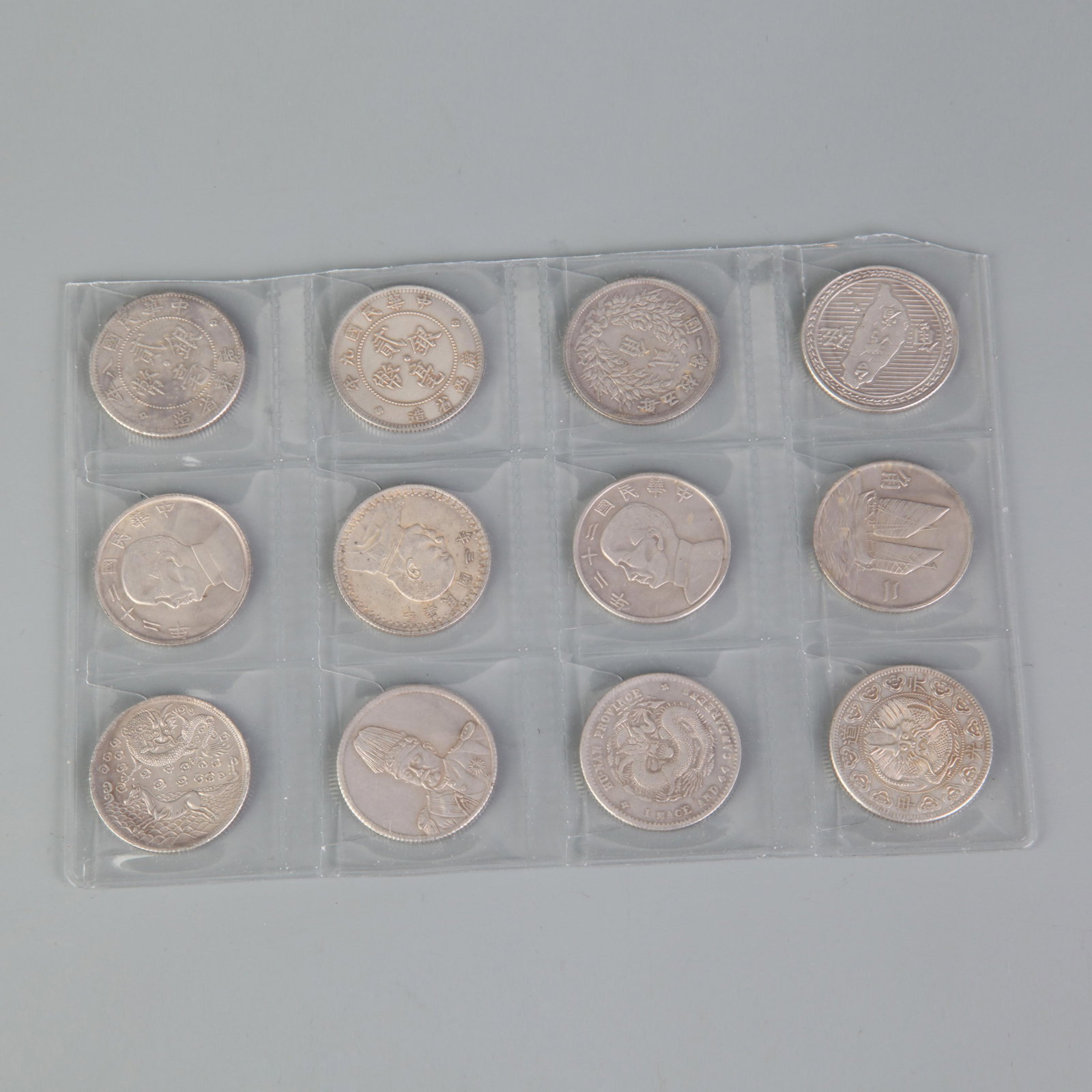 GROUP OF TWELVE SILVER DOLLARS