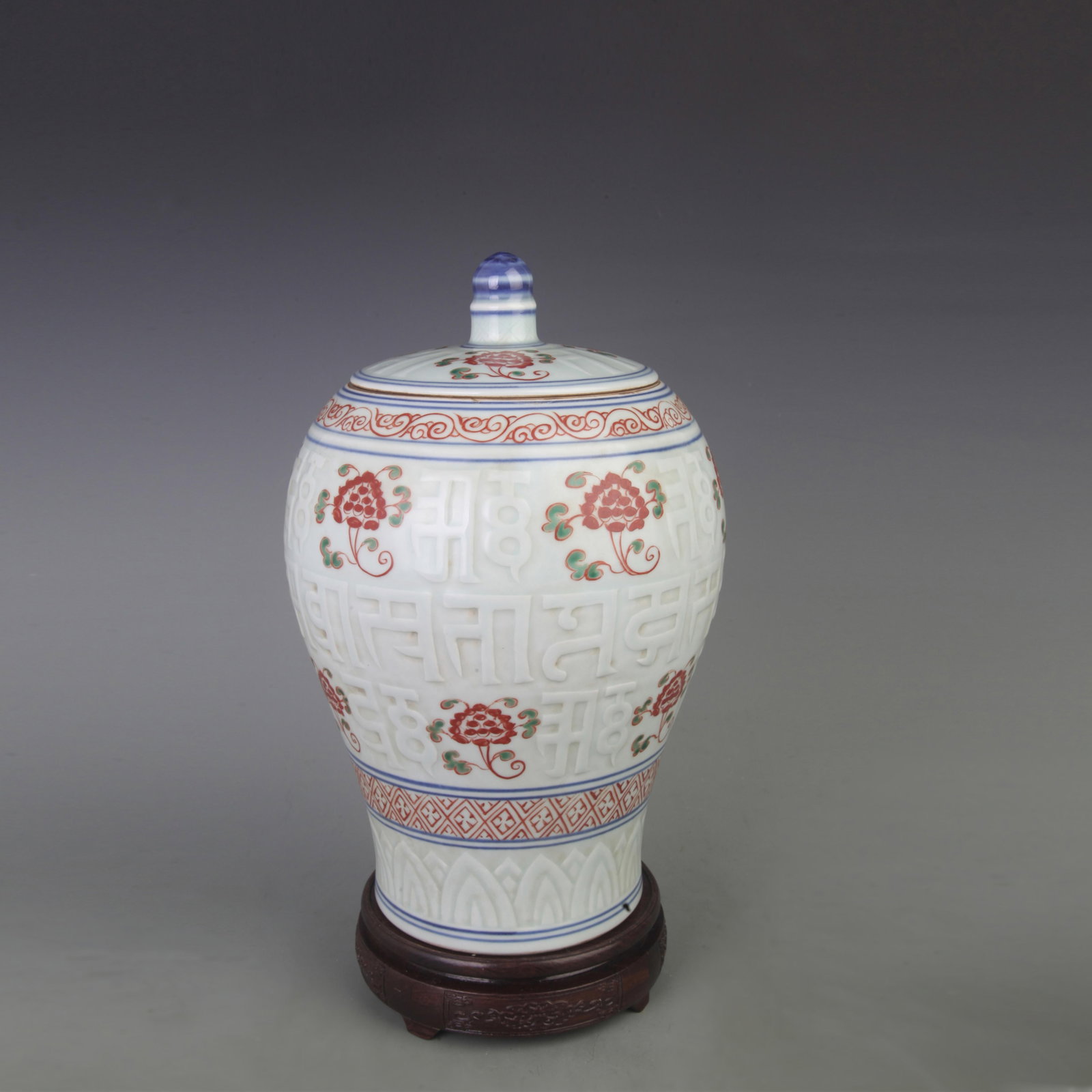 A FINE FAMILLE VERTE SANSKRIT ENGRAVED PORCELAIN VASE: Ming Dynasty Style; Diameter: 8.0 inch; High: 13.0 inch; . Wooden base for display only