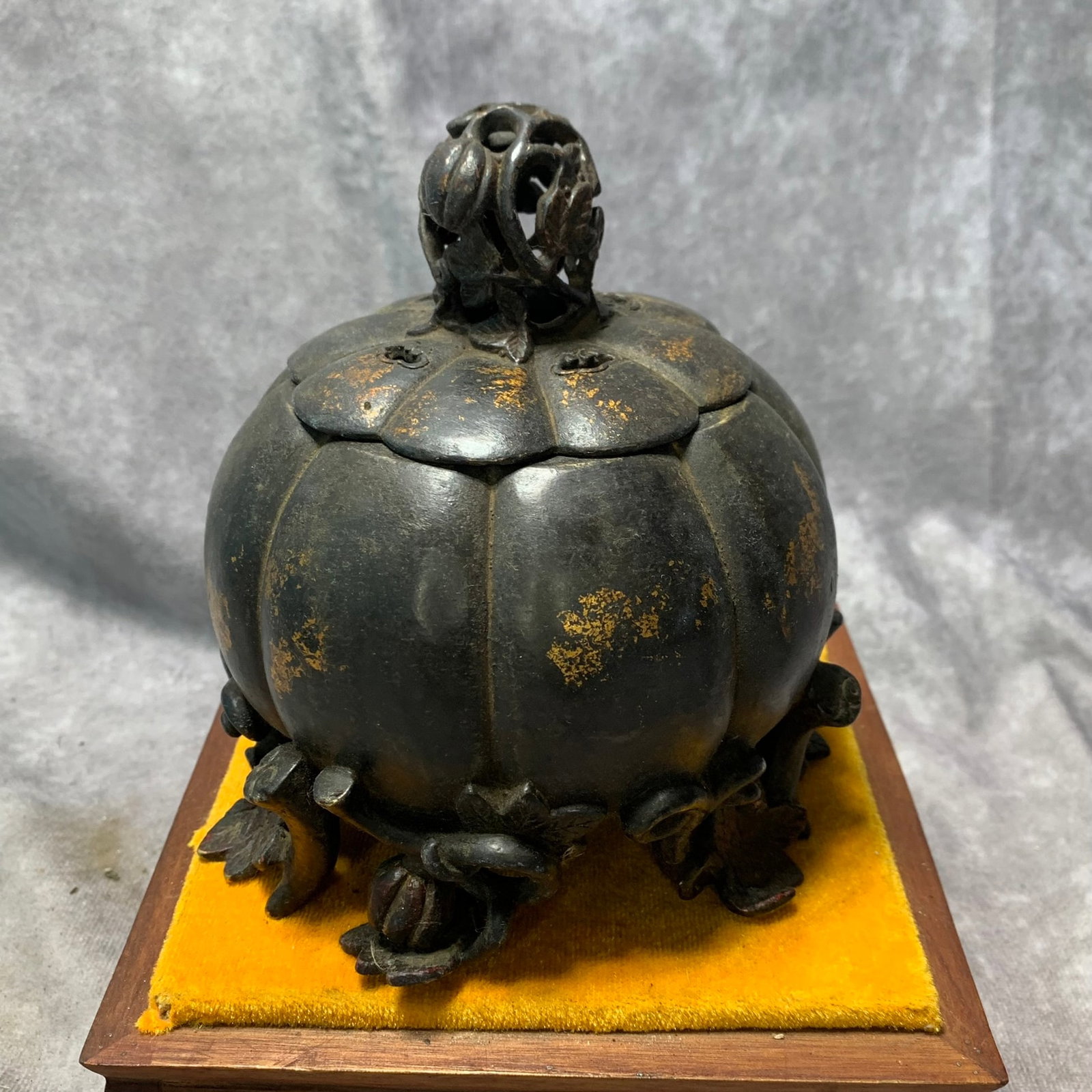 A QIANLONG MARKED AND PERIOD GILT-BRONZE FOOTED INCENSE BURNER WITH FRUIT MOTIF