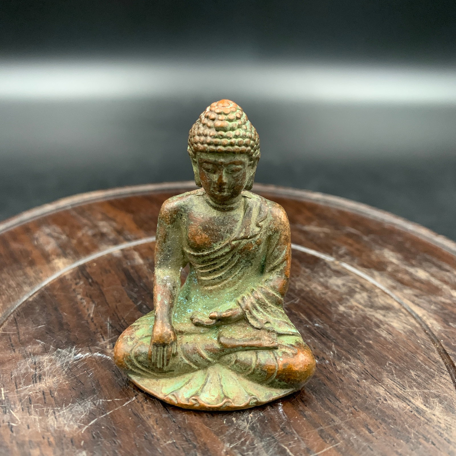 MINIATURE BRONZE SEATED SHAKYAMUNI BUDDHA: Republic Period; Long: 1.4 inch; Width: 1.1 inch; High: 1.9 inch; . Wooden base for display only