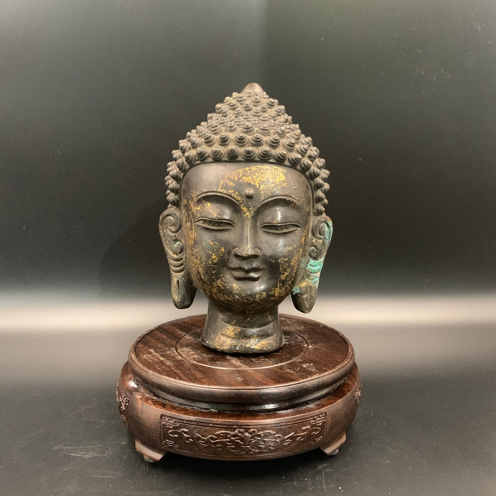 A FINE BRONZE BUDDHA HEAD: Qing Dynasty; Long: 4.8 inch; Width: 4.5 inch; High: 7.2 inch; . Wooden base for display only