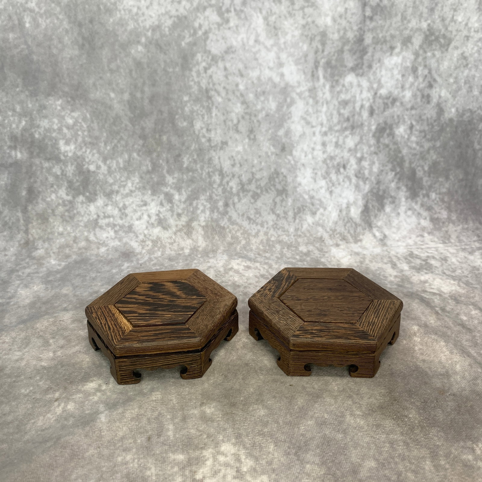 PAIR OF HEXAGONAL HARDWOOD DISPLAY STANDS: Modern; High: 1.3 inch; Diameter: 4.7 inch; . Wooden base for display only