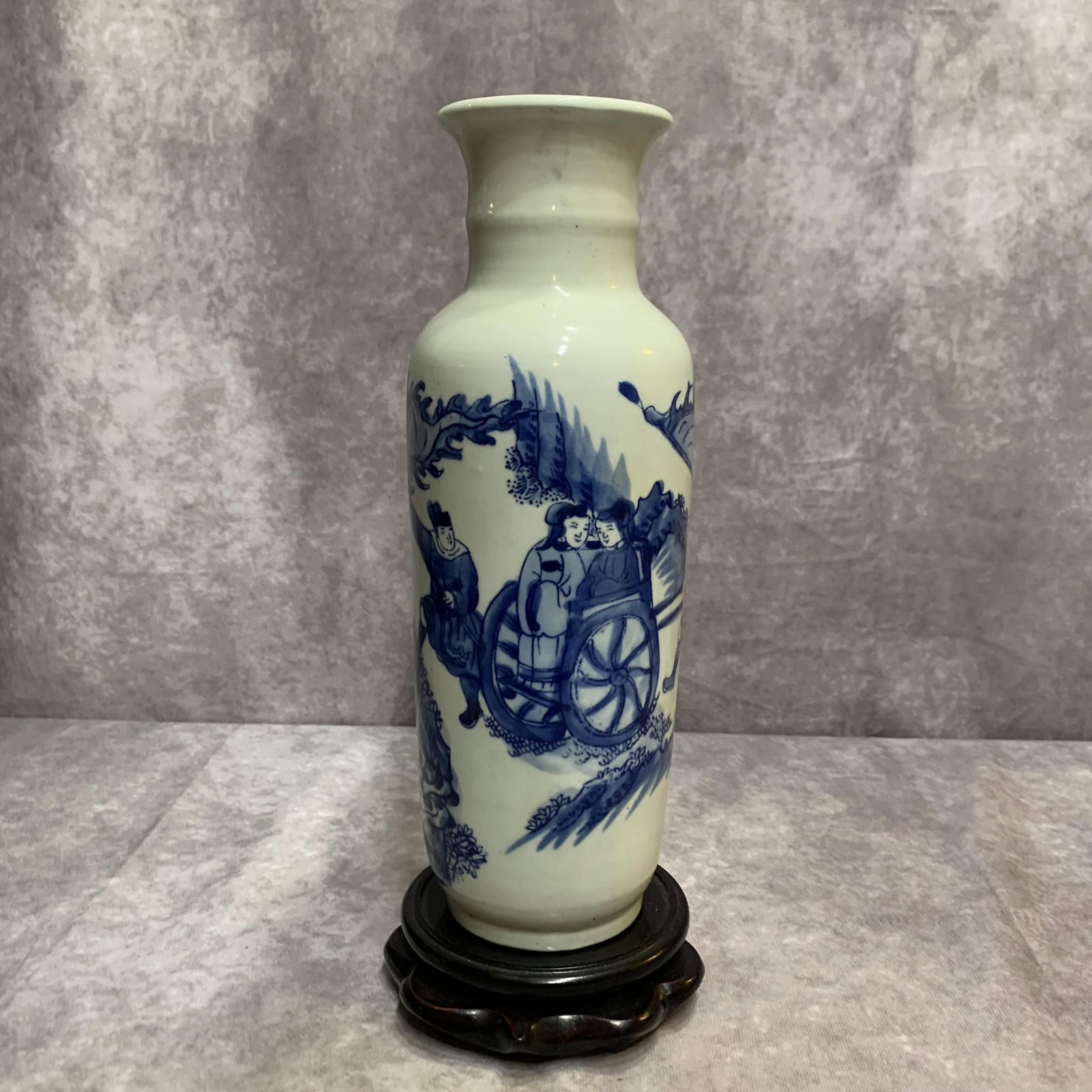 A BLUE-AND-WHITE LANDSCAPE PATTERN PORCELAIN VASE: 20th Century; High: 10.0 inch; Diameter: 3.5 inch. Wooden base for display only