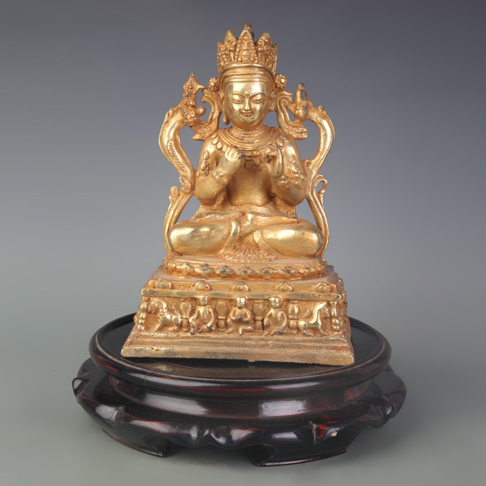 A RARE GILDED BRONZE STATUE OF A BUDDHIST DEITY