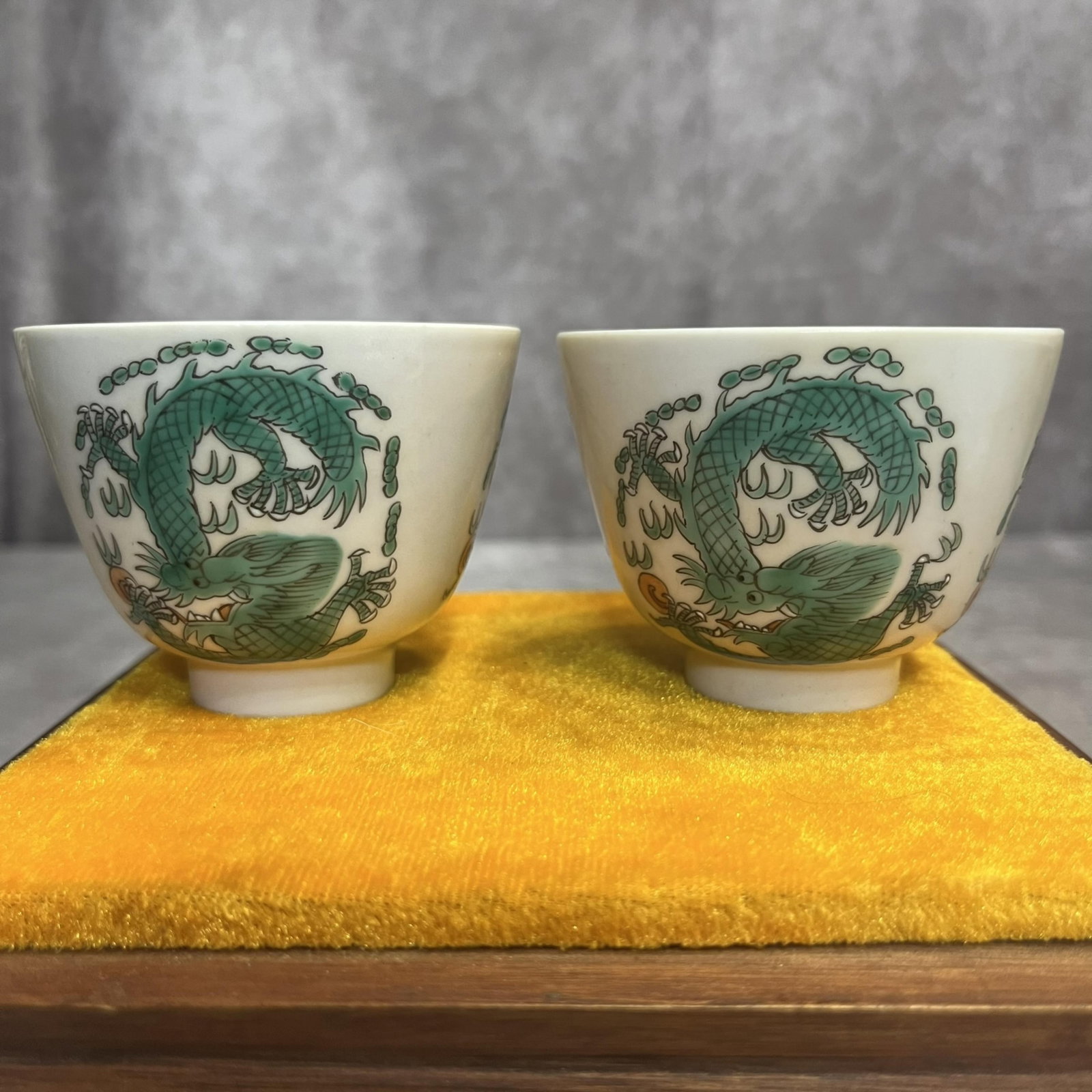 PAIR OF DRAGON PAINTED PORCELAIN CUP: Modern; High: 2.1 inch; Diameter: 2.8 inch; . Wooden base for display only