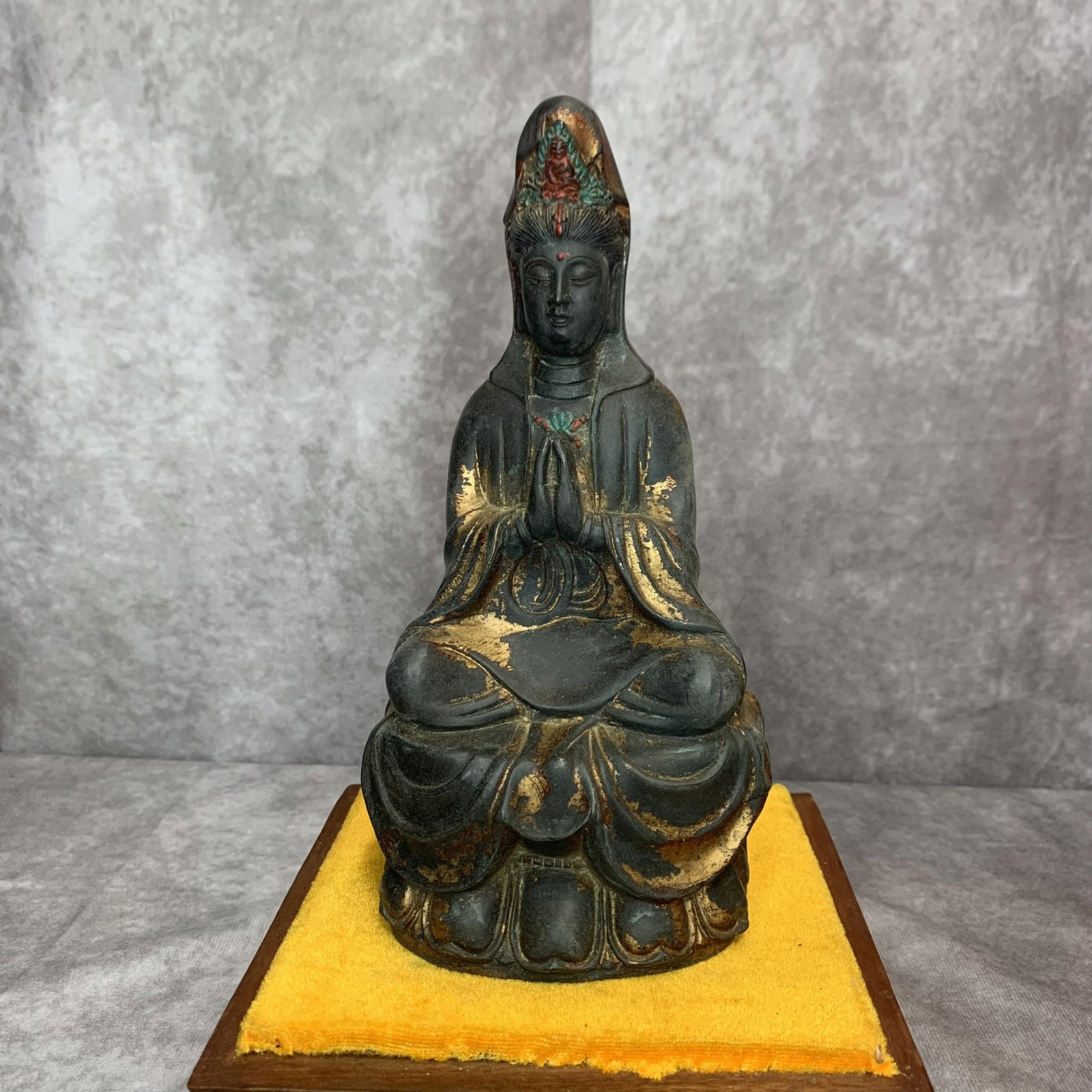 A FINE SMALL BRONZE FIGURE OF GUANYIN: Qing Dynasty; High: 8.3 inch; Width: 3.3 inch; Long: 4.0 inch. Wooden base for display only