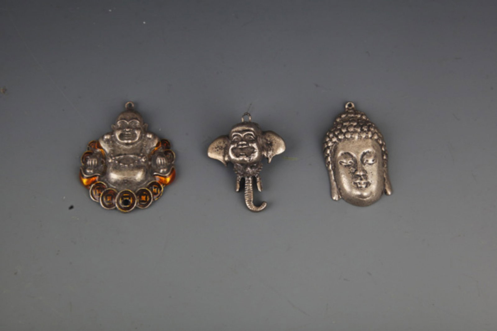 GROUP OF THREE SMALL BUDDHA PENDANT