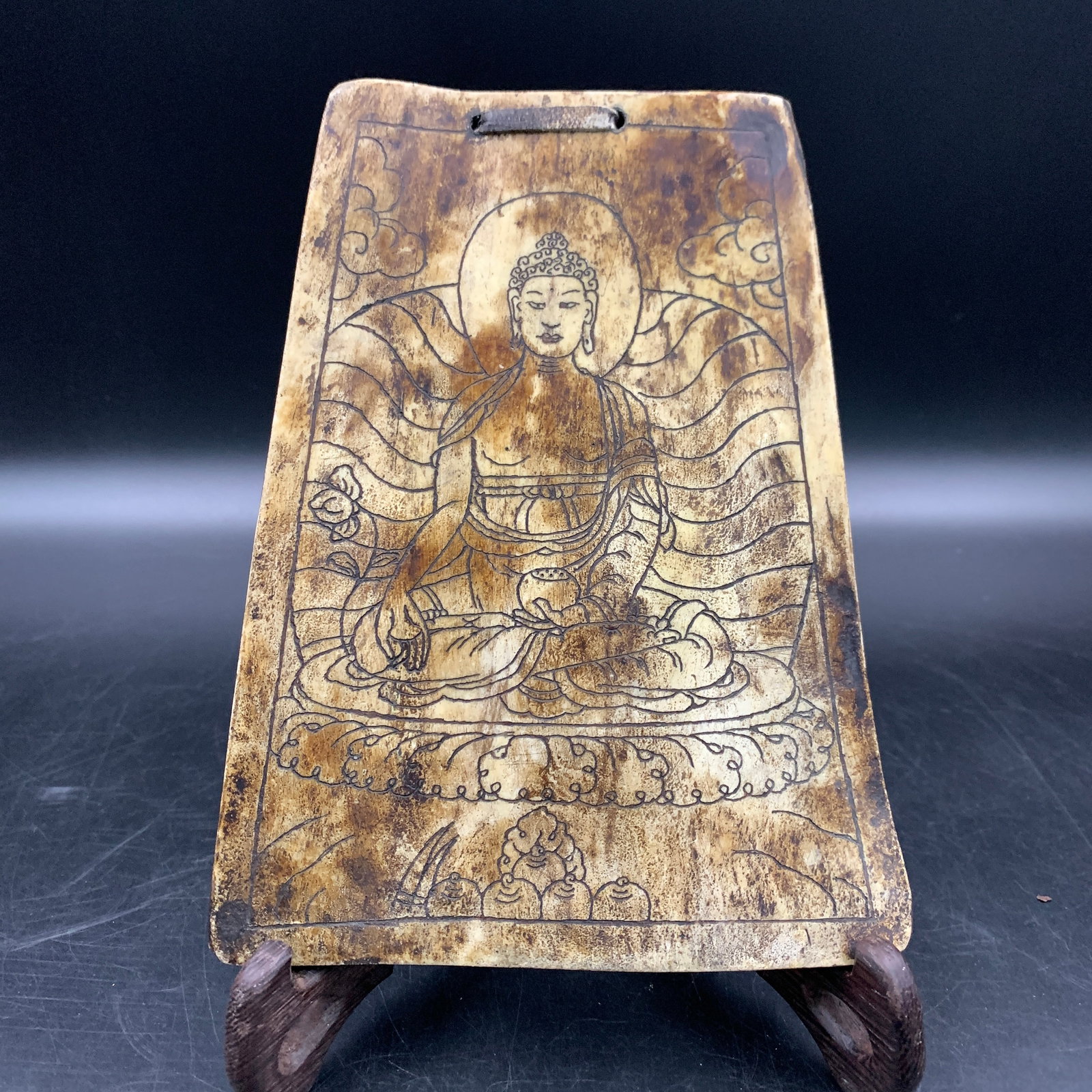 A FINE TIBETIAN BONE CARVING WITH SHAKYAMUNI BUDDHA