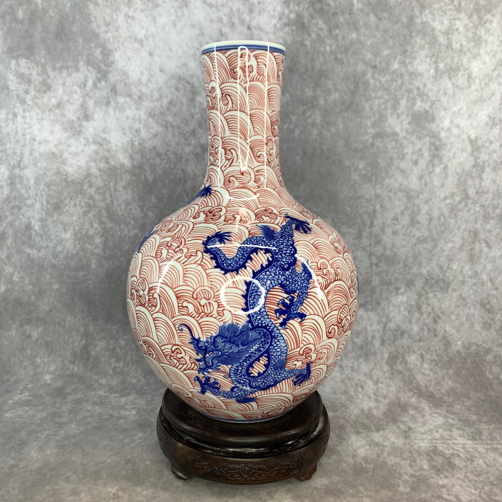 BLUE & UNDERGLAZE RED "DRAGON AND CHURNING WAVES" BOTTLE VASE