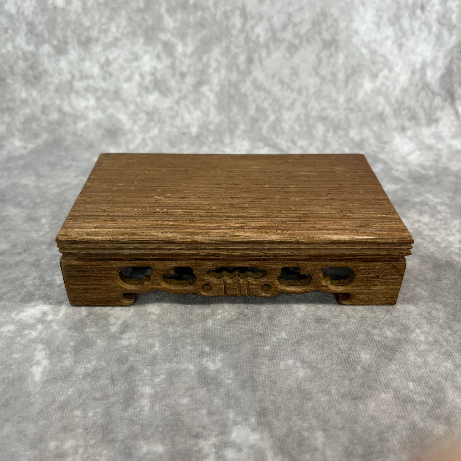 A FINE HARDWOOD MADE DISPLAY STAND
