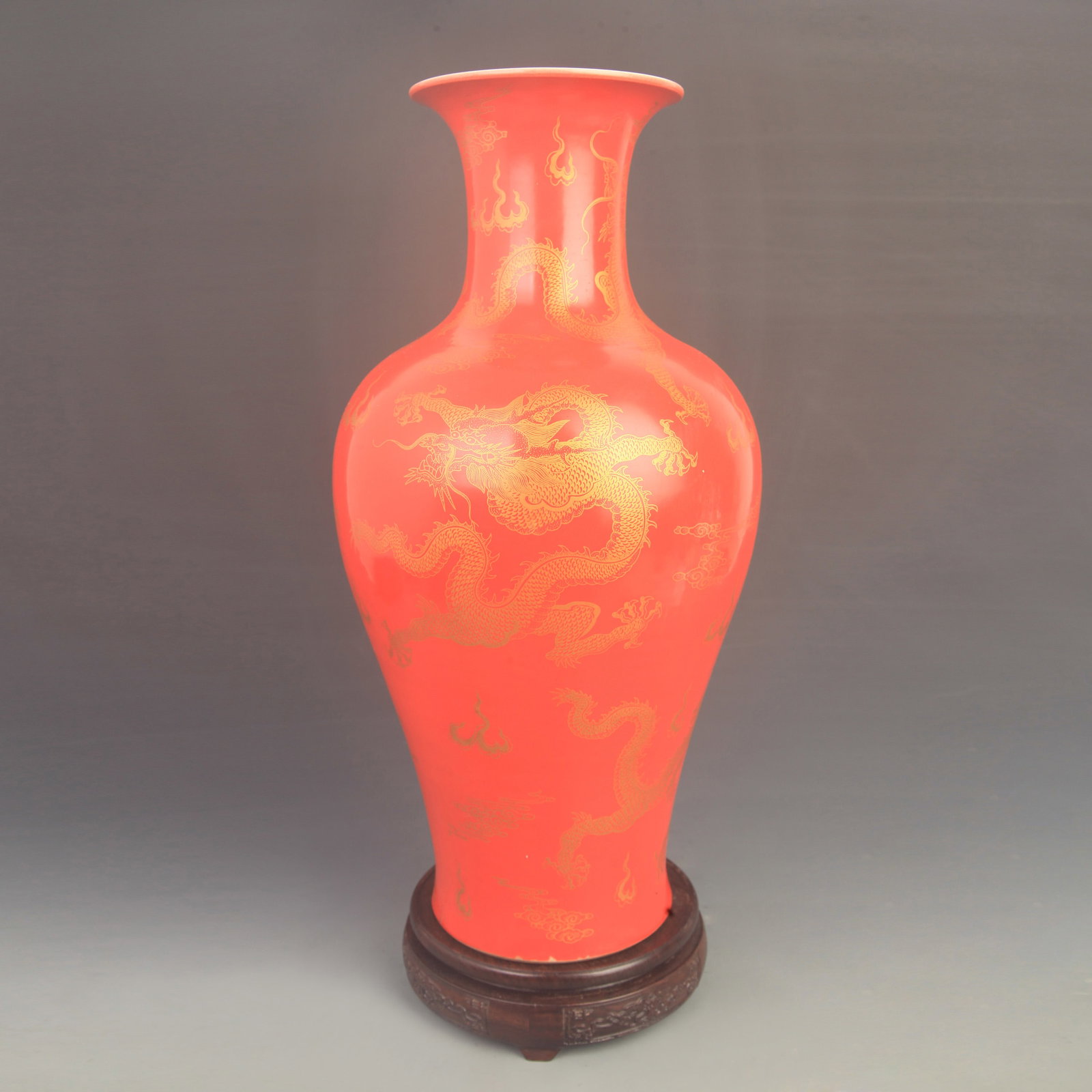 A FAMILLE ROSE RED-GROUND DRAGON VASE: Qing Dynasty Kang Xi Period; High: 16.8 inch; Diameter: 7.50 inch; . Wooden base for display only