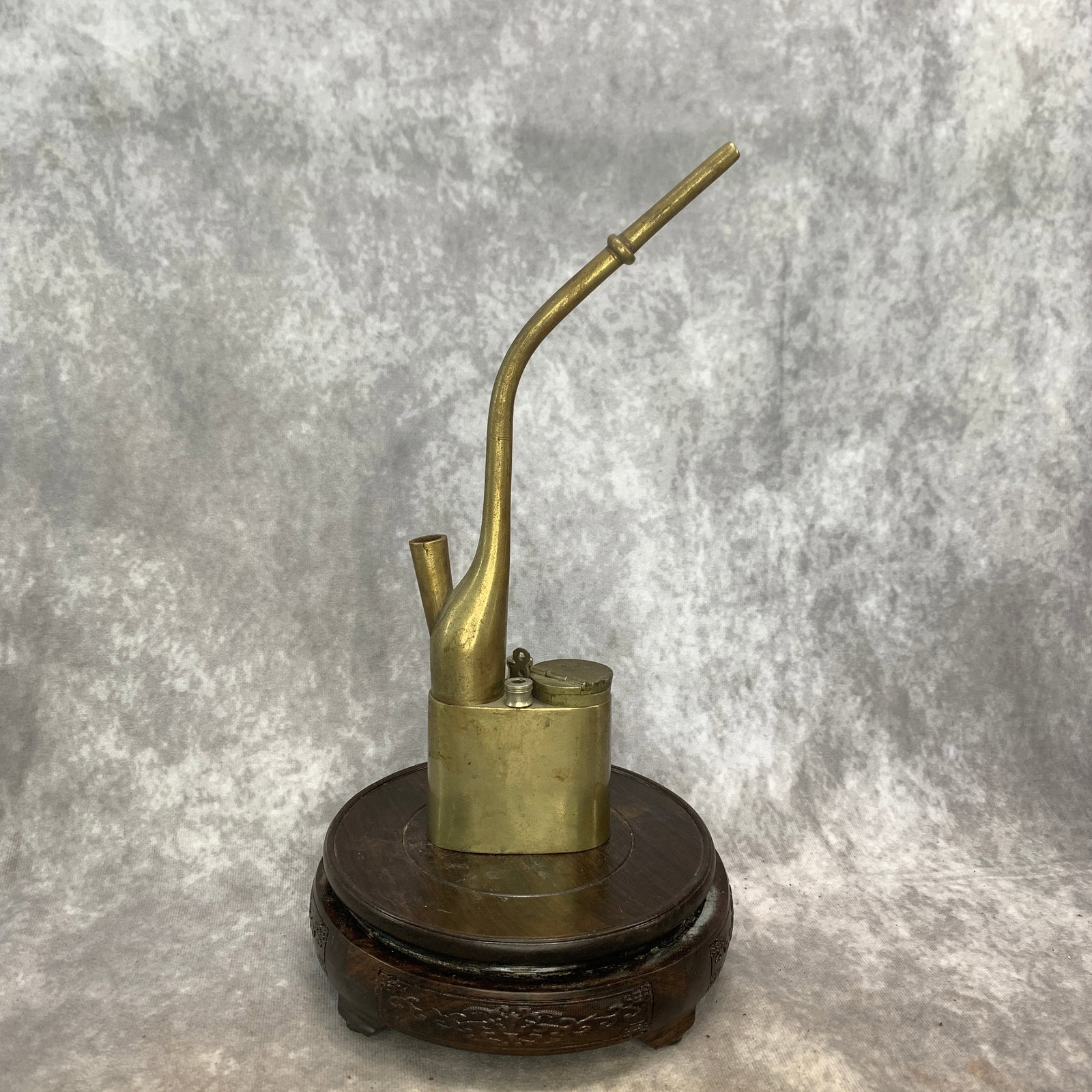 REPUBLIC-PERIOD BRASS WATER PIPE: Republic Period; Long: 2.9 inch; Width: 1.4 inch; High: 10.8 inch; . Wooden base for display only