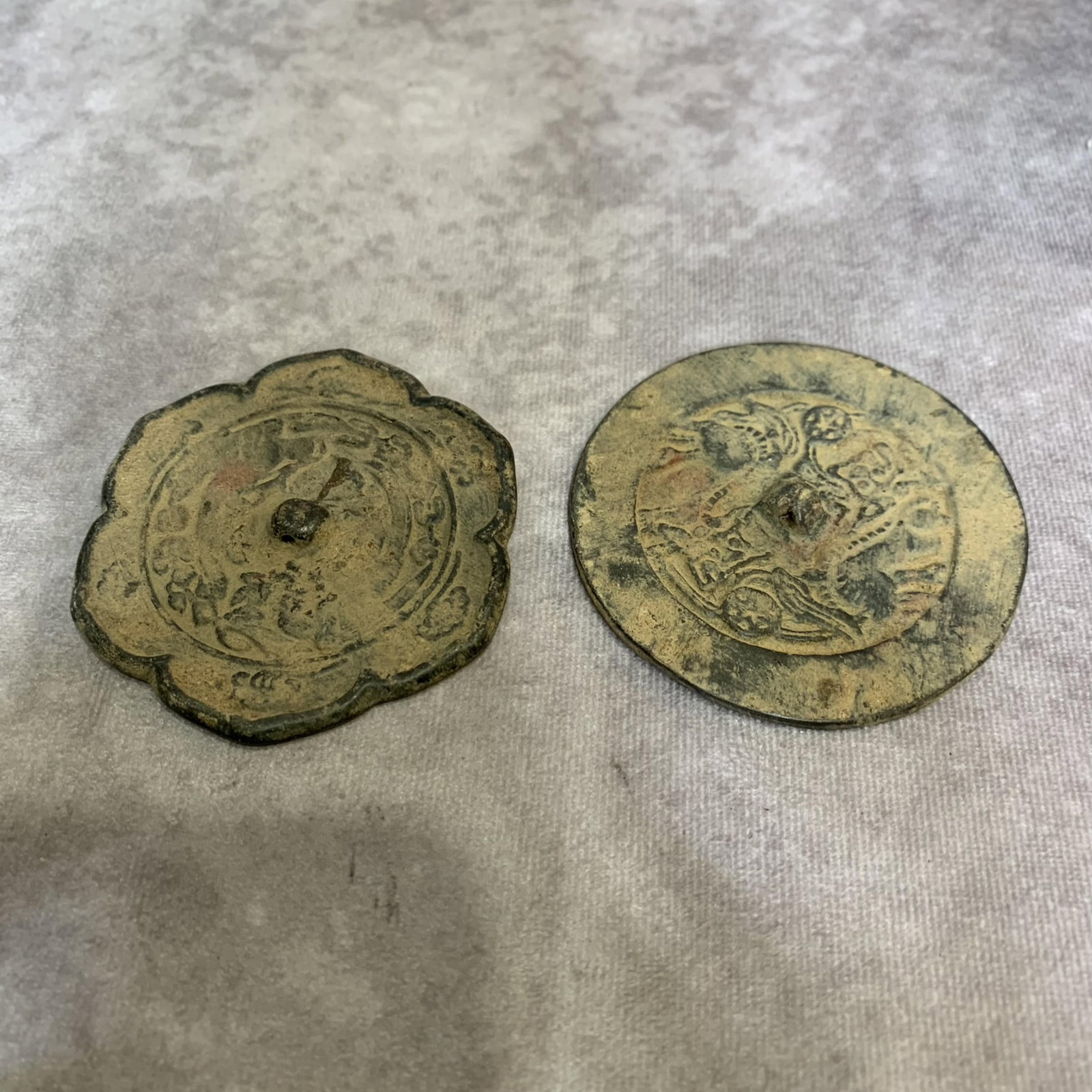 PAIR OF SMALL FINELY CARVED BRONZE MIRROR: Yuan Dynasty Style; Diameter: 3.1 incHigh: Diameter: 3.0 inch . Wooden base for display only