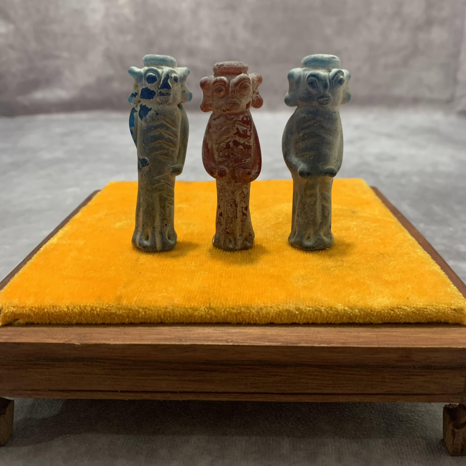 GROUP OF THREE SMALL GLASS HUMAN FIGURE: Long: 0.8 inch; Width: 2.7 inch; . Wooden base for display only