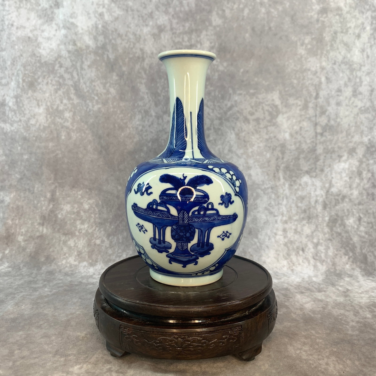 BLUE AND WHITE "PRECIOUS OBJECTS" PATTERN PORCELAIN VASE: Qing Dynasty; High: 7.7 inch; Diameter: 4.4 inch; . Wooden base for display only