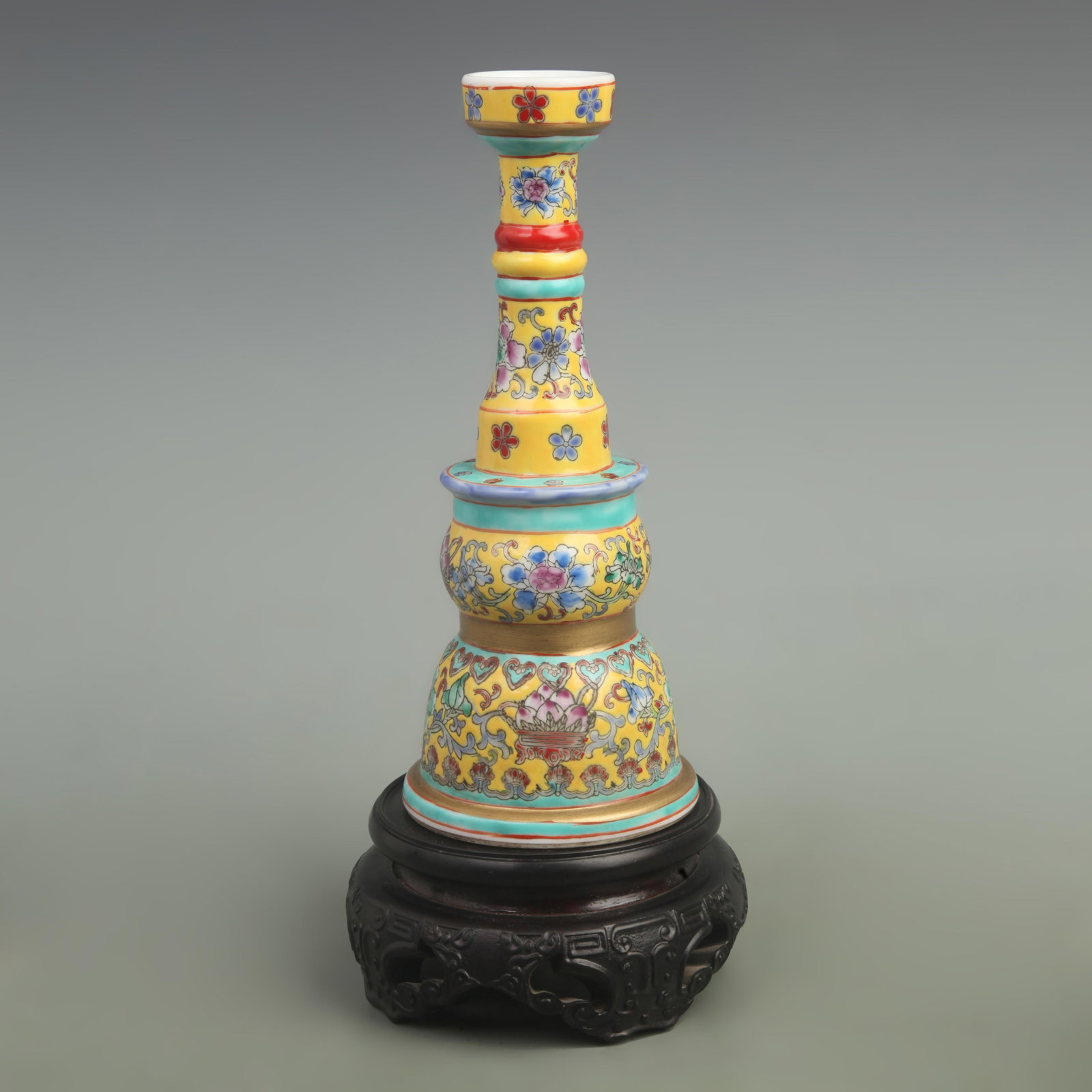 FAMILLE ROSE YELLOW GROUND PORCELAIN CANDLESTICKS: Qing Dynasty Qian Long Period; High: 10.3 inch; Diameter: 4.1 inch; . Wooden base for display only