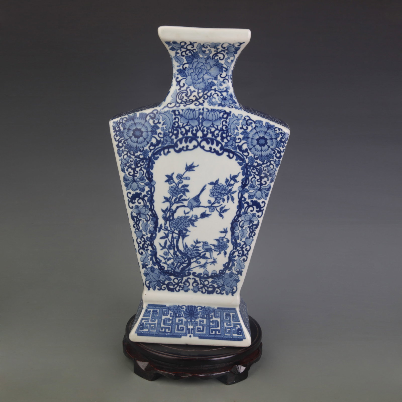 A BLUE AND WHITE SQUARE VASE WITH CARTOUCHES OF BIRD-AND-FLOWER