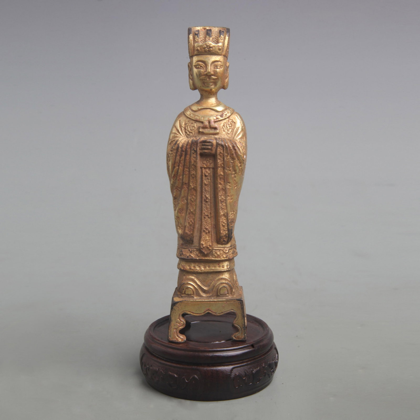 A FINE GILT BRONZE GOD OF WEALTH STATUE: Qing Dynasty; High: 6.0 inch; High: 1.5 inch; . Wooden base for display only