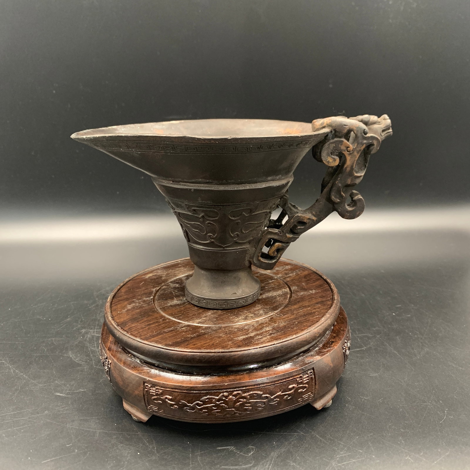 A FINE BRONZE LIBATION WINE SERVERS