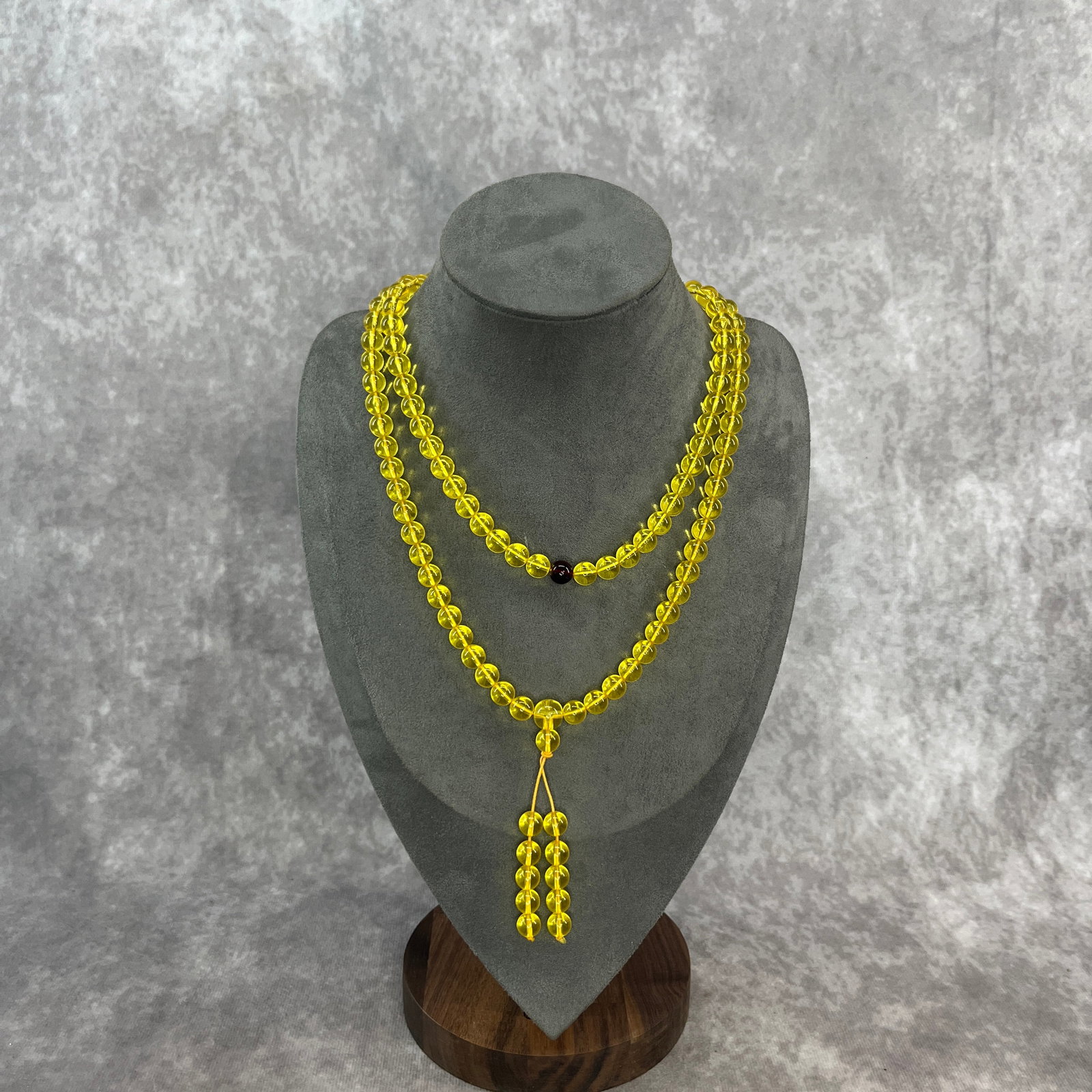 A FINE CHINESE BUDDIST MALA PRAYER BEAD NECKLACE: Modern; Long: 17.5 inch; Diameter: 0.3 inch; . Wooden base for display only