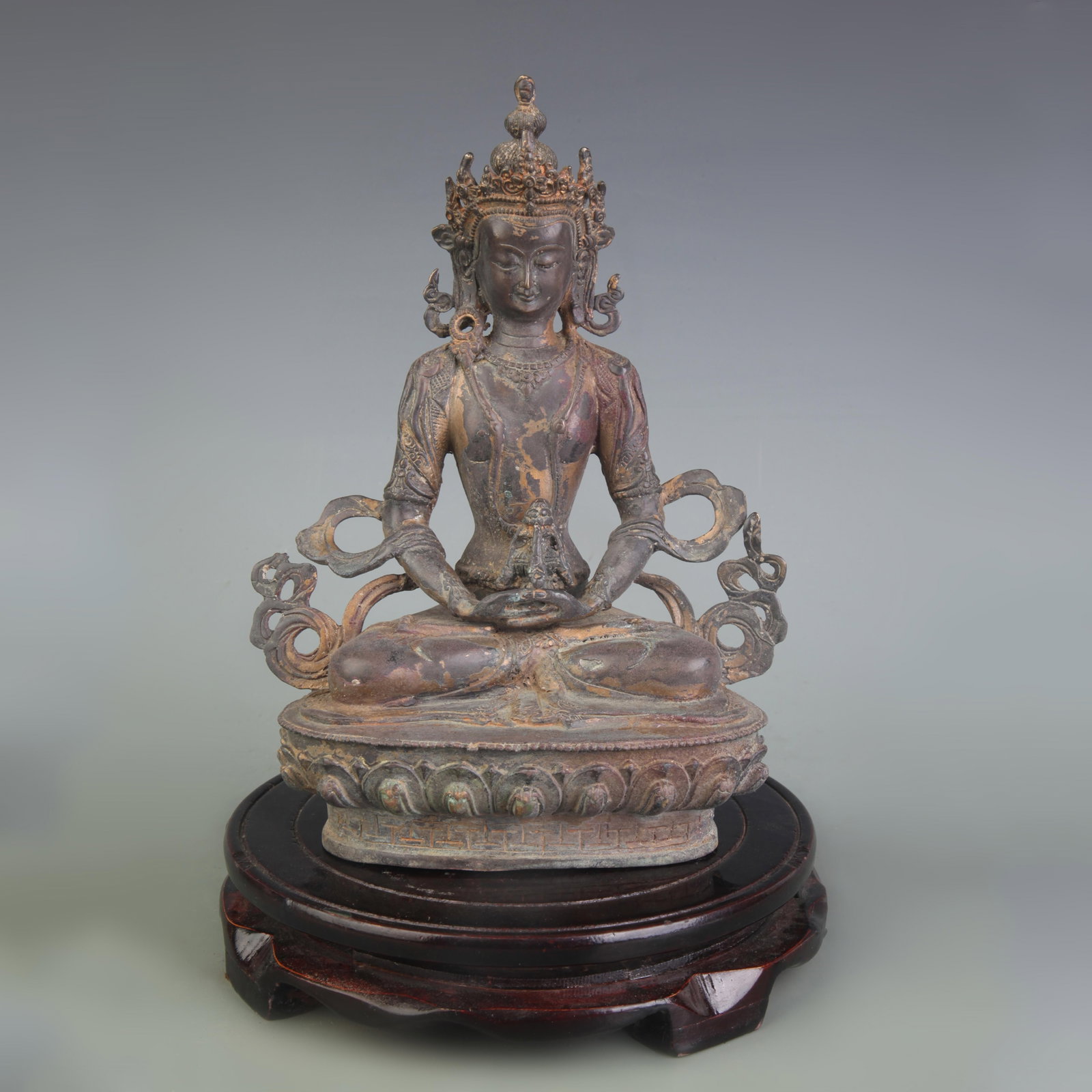A FINE BRONZE LONGEVITY BUDDHA STATUE: Qing Dynasty; High: 8.4 inch. Wooden base for display only