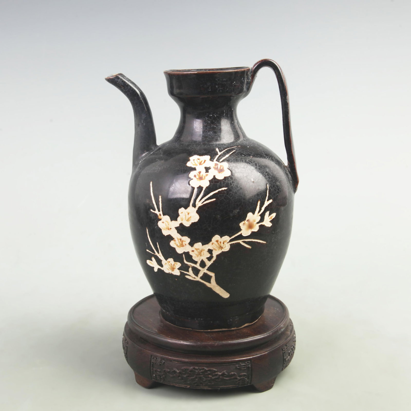 A FINE BLACK COLOR GLAZED PLUM BLOSSOM PATTERN PORCELAIN EWER: Tang Dynasty Style; High: 7.5 inch; Diameter: 3.2 inch; . Wooden base for display only