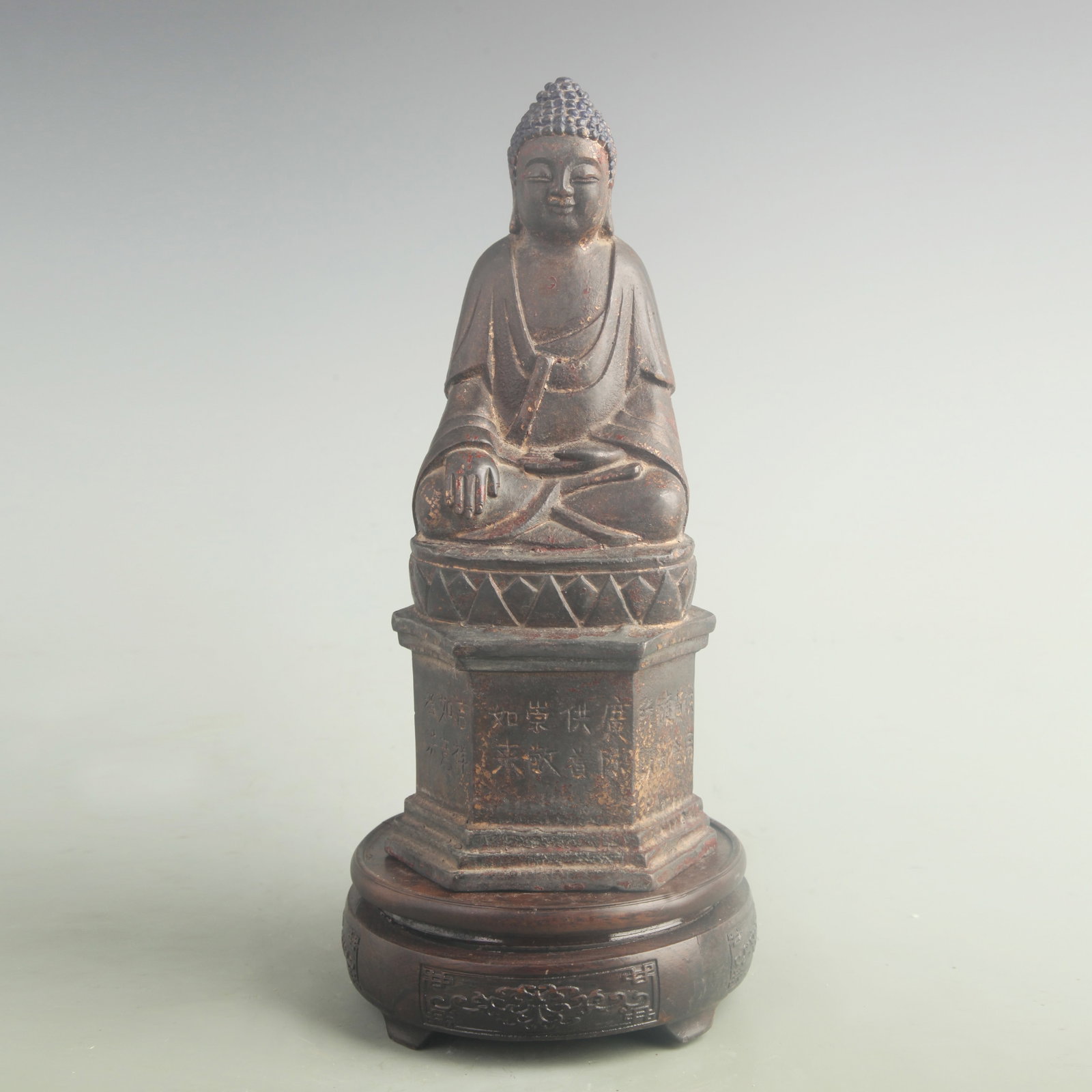 A GILT BRONZE SHAKYAMUNI BUDDHA: 18th Century; High: 10.0 inch; Width: 4.20 inch. Wooden base for display only