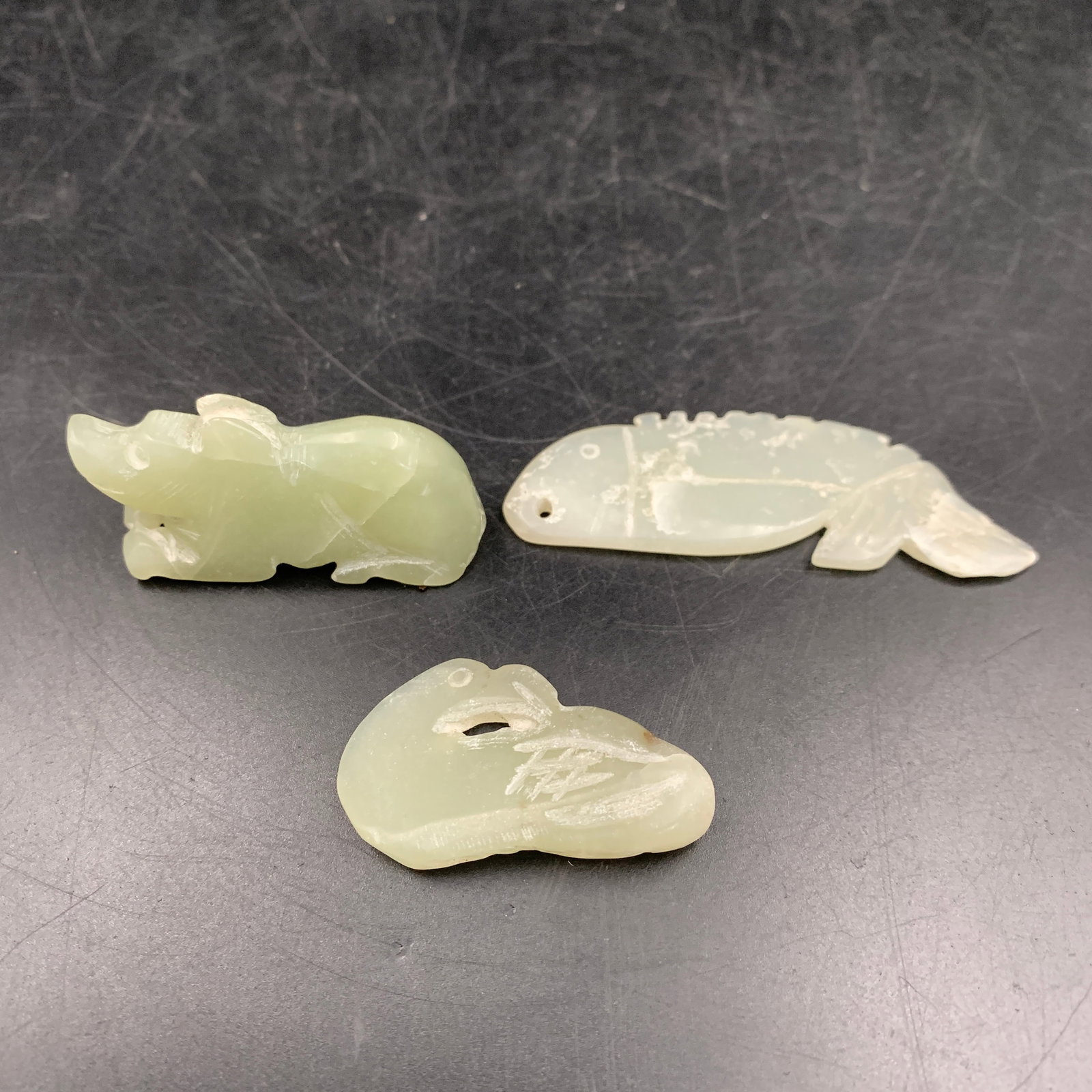 GROUP OF THREE HETIAN JADE PENDANT