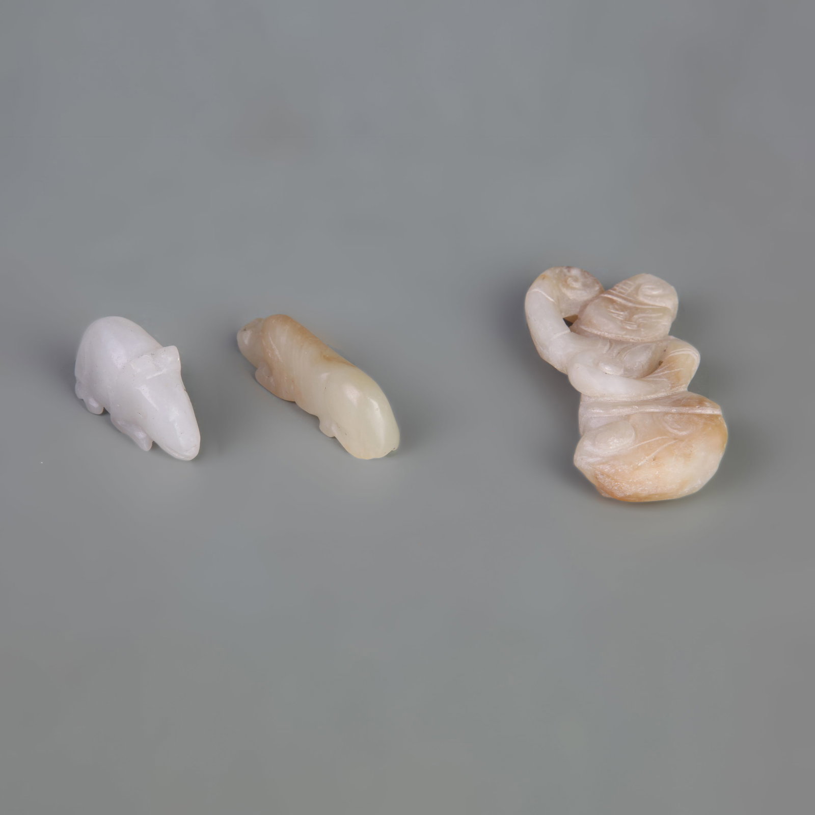 GROUP OF HETIAN JADE PENDANTS