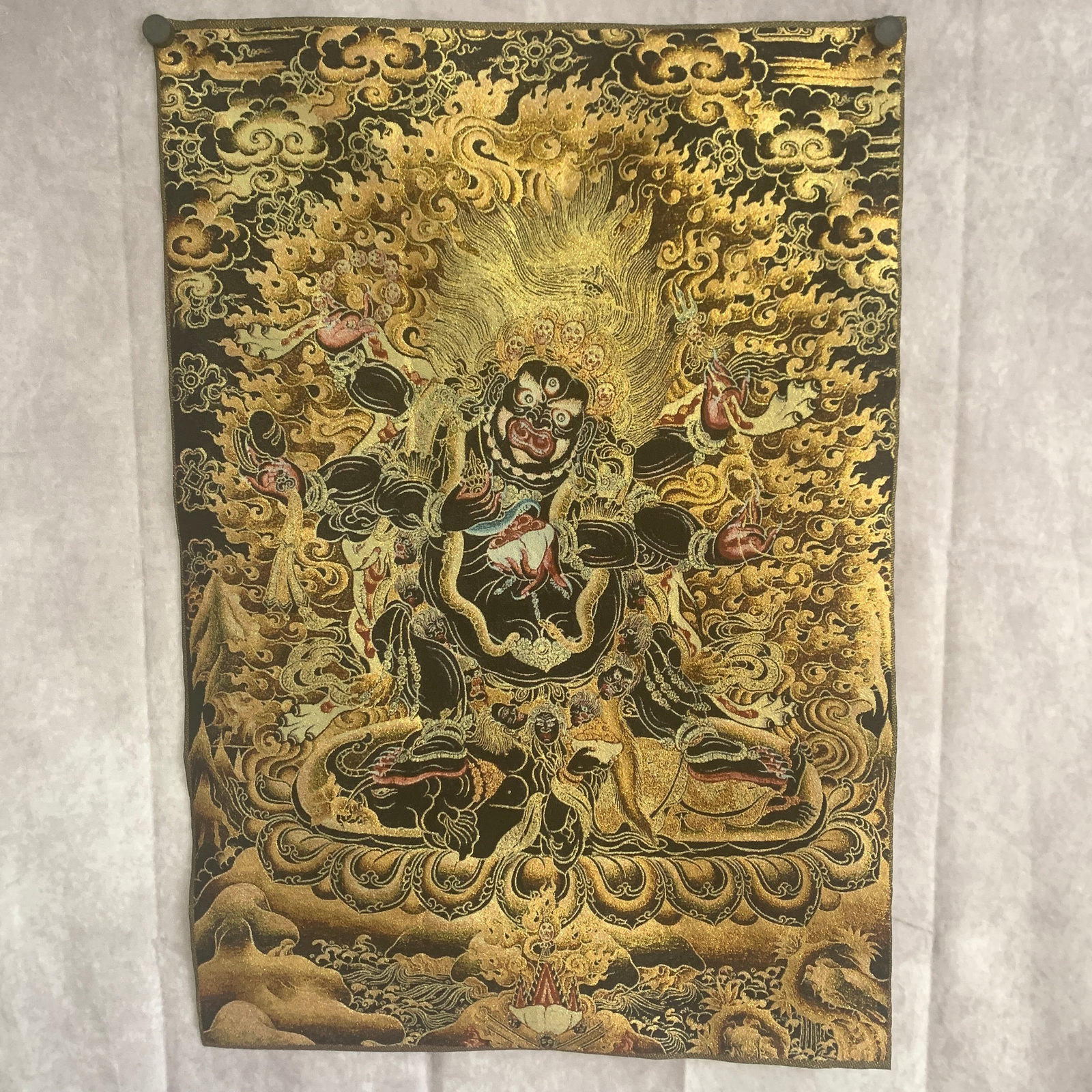 BLACK-GROUND THANGKA ON SILK: MAHAKALA: Modern; Long: 28 inch; Width: 19.4 inch; . Wooden base for display only