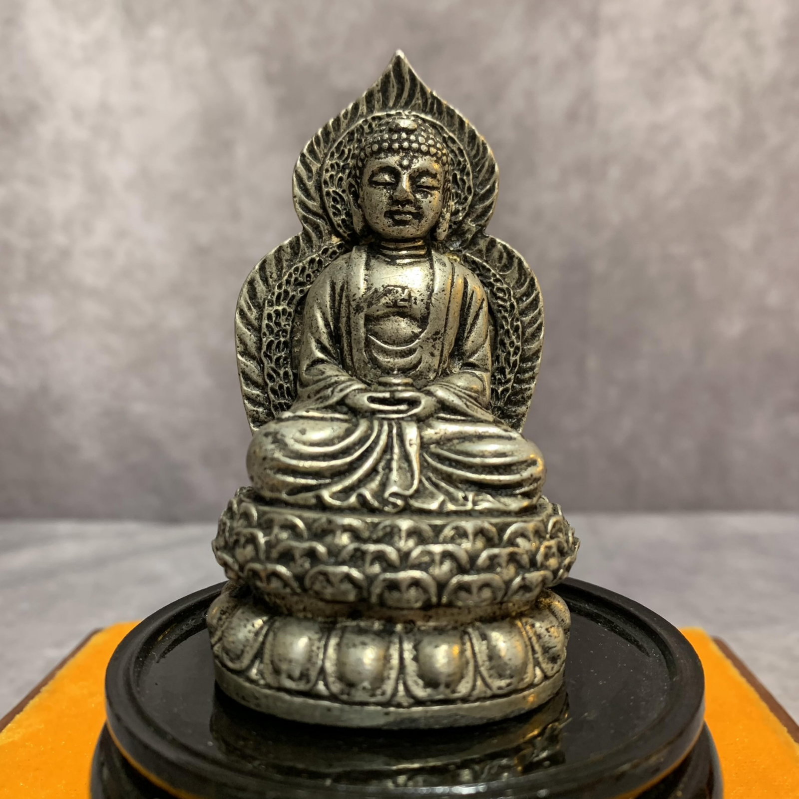 A FINE SMALL WHITE BRONZE GAUTAMA BUDDHA STATUE: 20th Century; Width: 1.9 inch; High: 3.4 inch; . Wooden base for display only